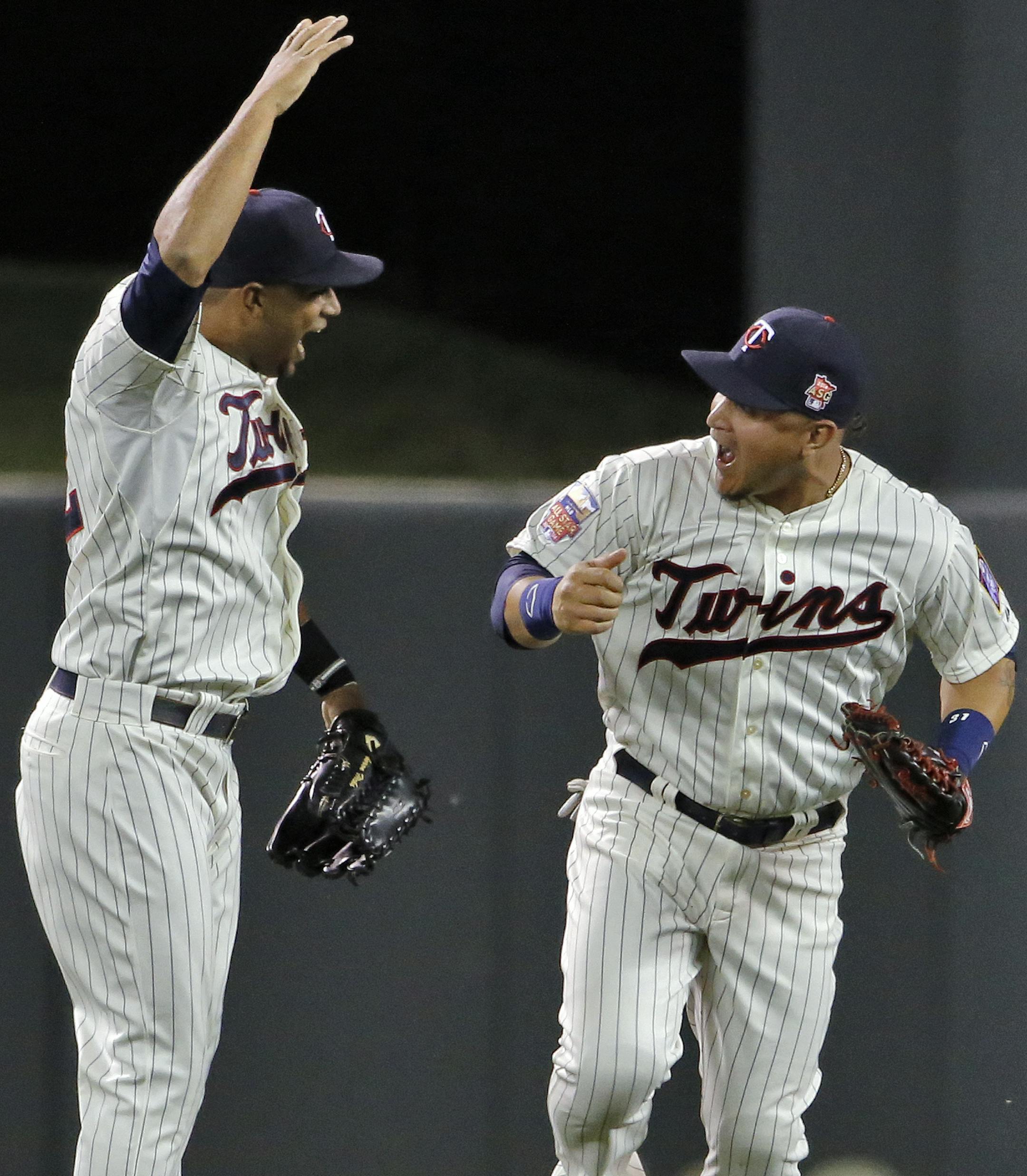 Twins outfielders Aaron Hicks, left, and Oswaldo Arcia celebrate the Twins win at the end of the game. ] Minnesota Twins vs. Milwaukee Brewers. Twins won 6-4. (MARLIN LEVISON/STARTRIBUNE(mlevison@startribune.com)