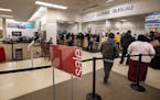 People stood in line at the License Bureau inside of the Sears in St. Paul, MN.