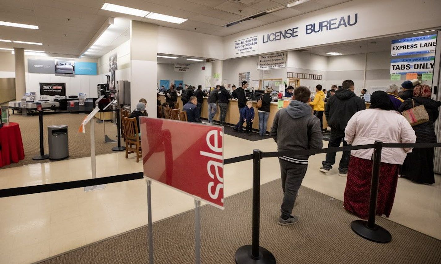 People stood in line at the License Bureau inside of the Sears in St. Paul, MN.