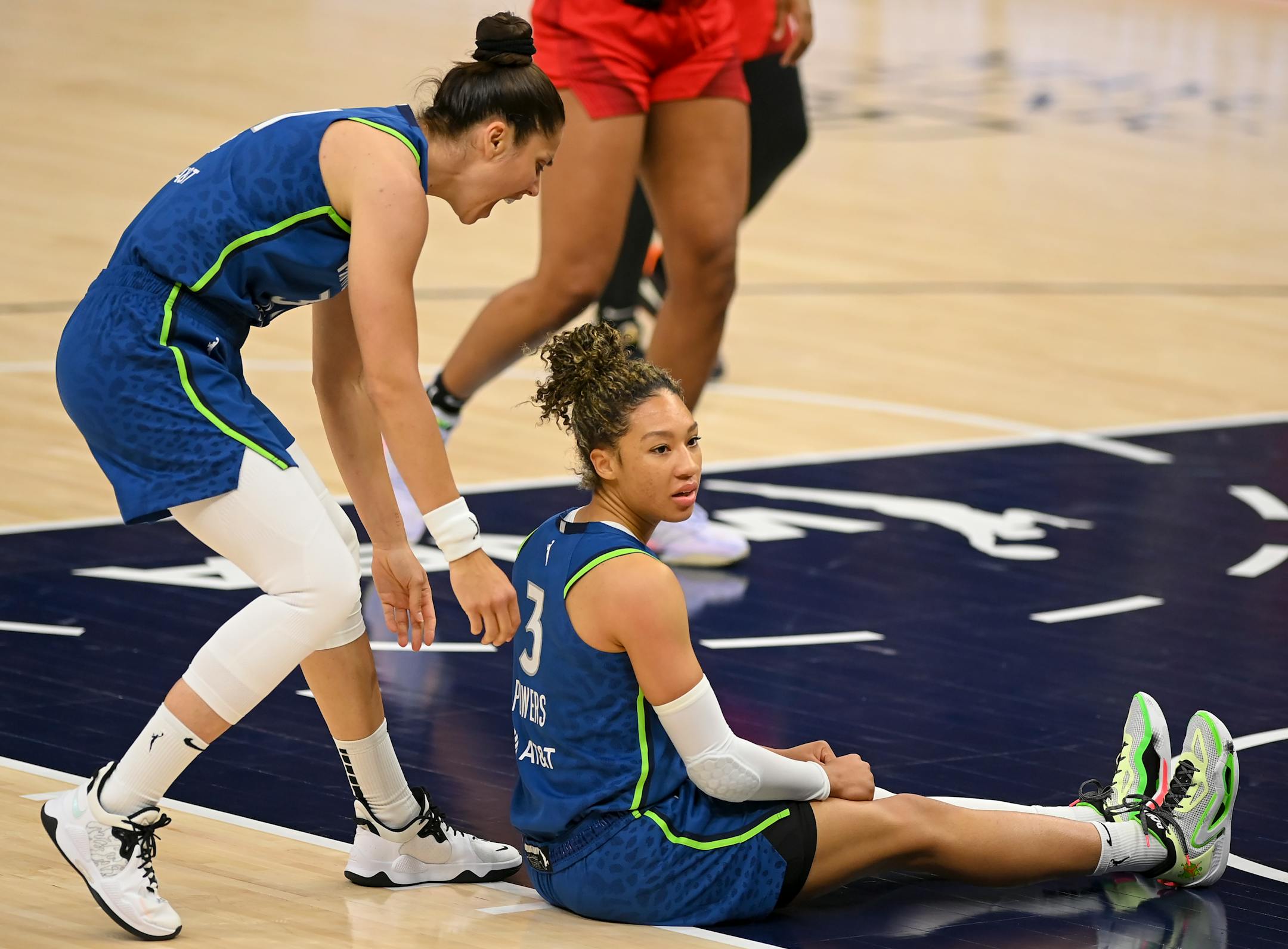 Minnesota Lynx forward Aerial Powers and forward Nikolina Milic celebrate after Powers drew a foul on a basket for an and-one opportunity in the first quarter.