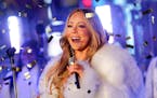 FILE - In this Dec. 31, 2017 file photo, Mariah Carey performs at the New Year's Eve celebration in Times Square in New York. Carey, one of the world'