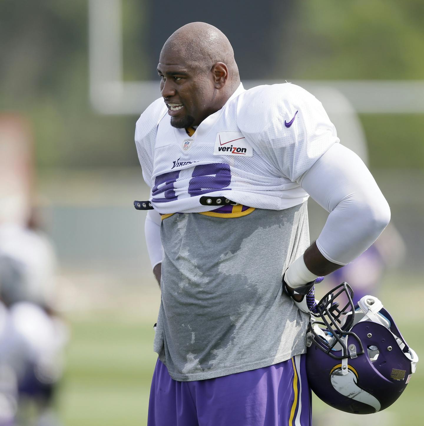 Minnesota Vikings defensive tackle Tom Johnson looks on during an NFL football training camp practice, Friday, Aug. 1, 2014, in Mankato, Minn. (AP Photo/Charlie Neibergall) ORG XMIT: MIN2014082719145161