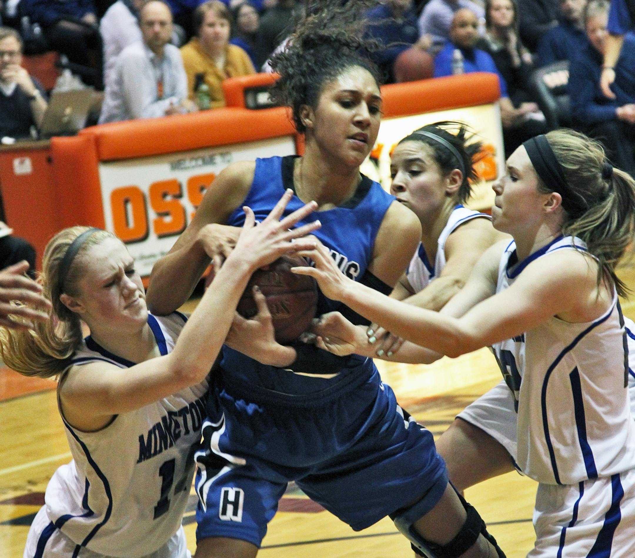 Minnetonka defenders applied the defensive pressure to Hopkins' Mikaala Shackelford, who missed last season with an ACL injury.