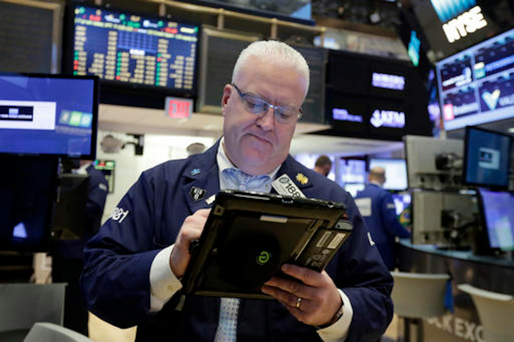 Trader Thomas Ferrigno works on the floor of the New York Stock Exchange, Monday, Nov. 7, 2016. Stocks are opening sharply higher on Wall Street after the F.B.I. said newly discovered emails didn't warrant any action against presidential candidate Hillary Clinton. (AP Photo/Richard Drew)