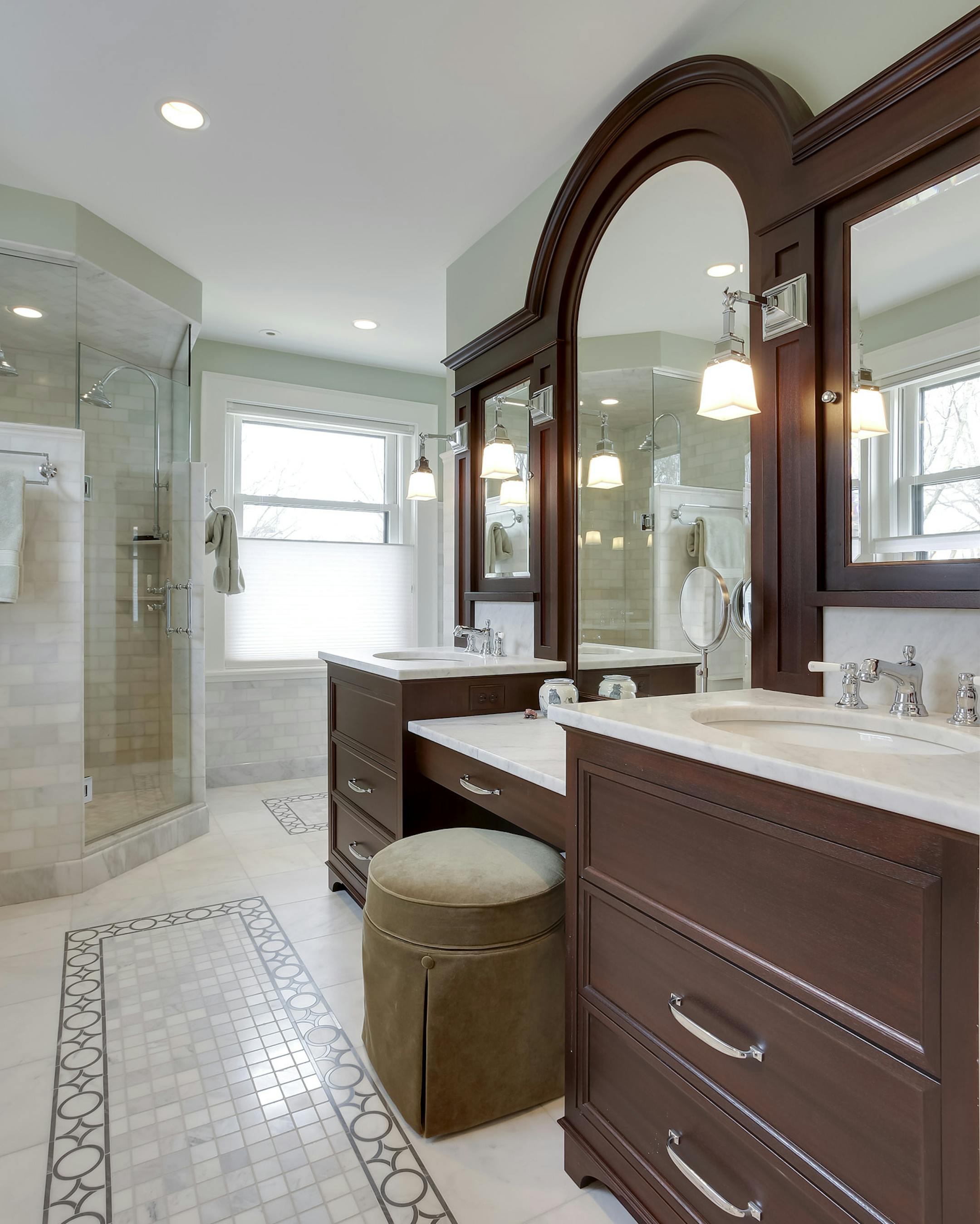 The marble and mahogany master bathroom is warmed by in-floor heat.
