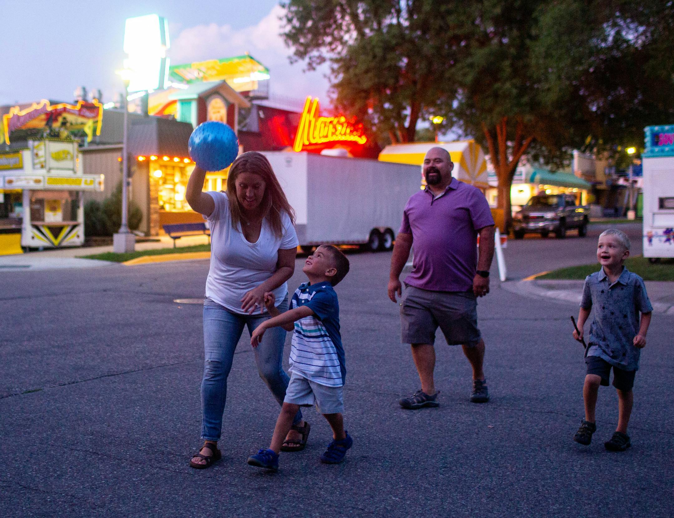 From left, Jennie, Danny, Bryan and Grant Enloe walked to the grandstand at the Minnesota State Fair.