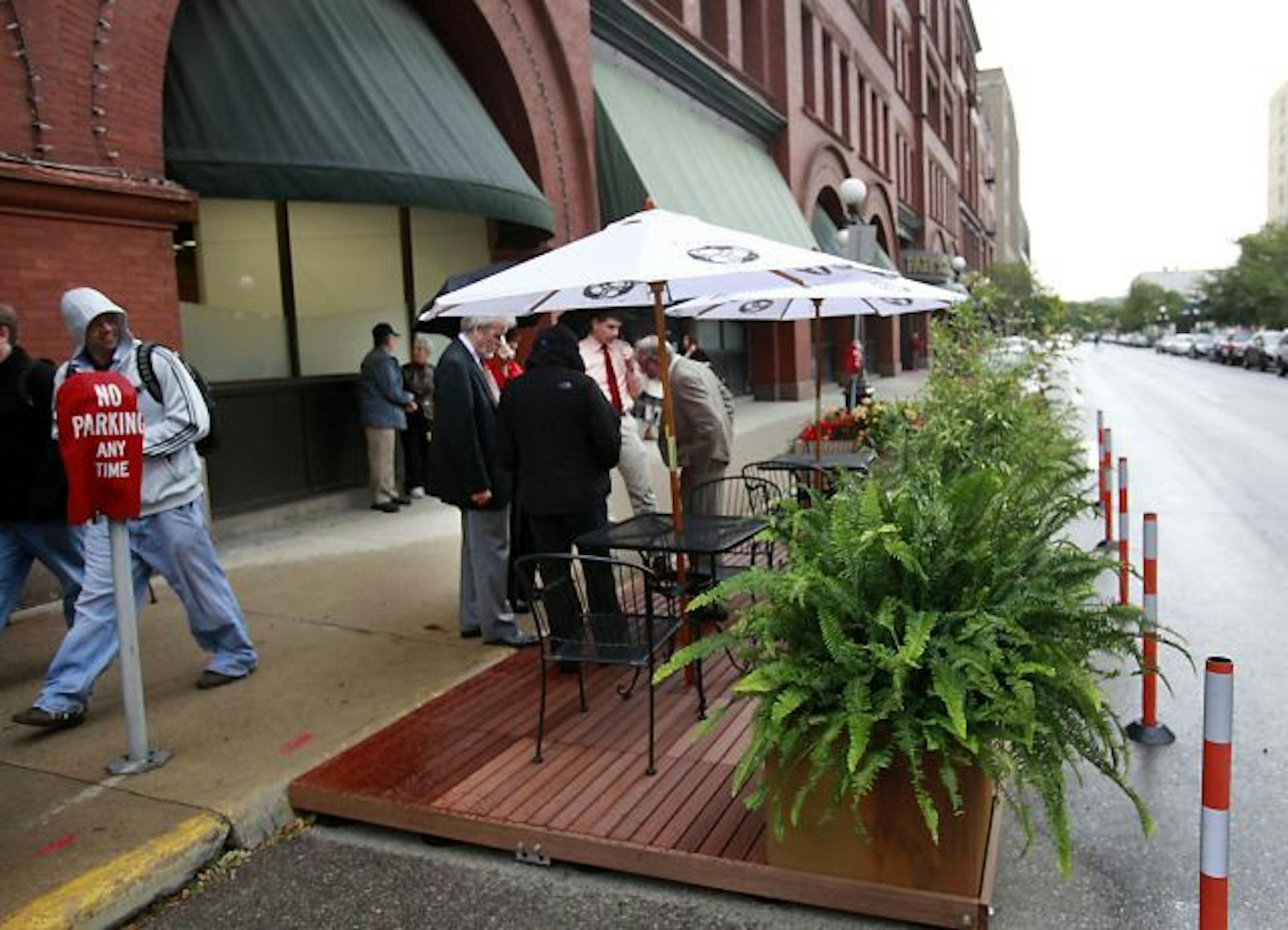 Bin Wine Bar in St. Paul is testing a "pop-up cafe," an inexpensive deck system that extends the sidewalk so patrons can dine in the street. The decks, all the rage on the coasts, are designed to beef up nightlife while keeping sidewalks clear. Supporters say the decks can be removed in winter to create more parking space.
