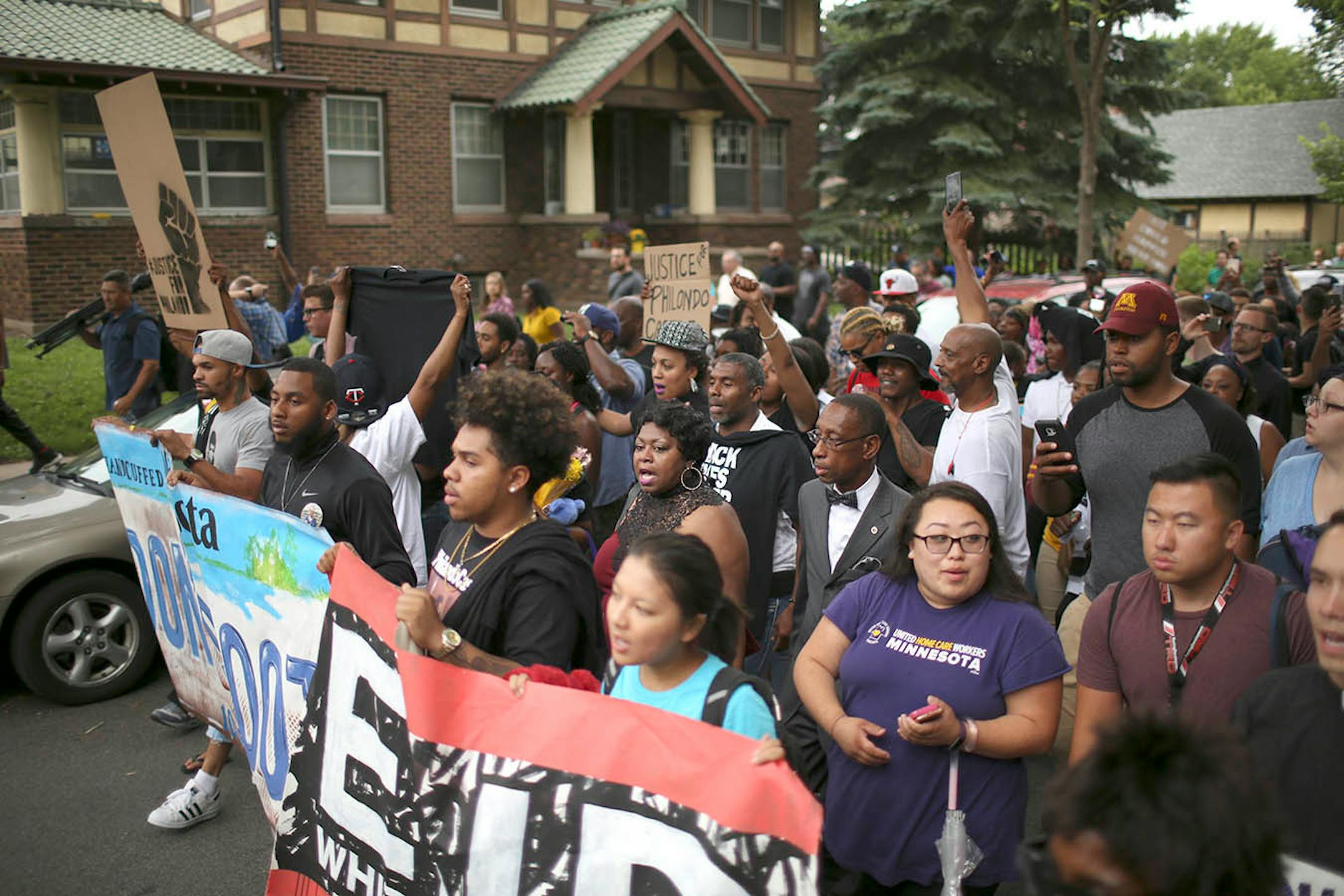Valerie Castile, the mother of Philando Castile, center, was among the family members who led marchers from the J.J. Hill Montessori Magnet School to the Governor's Mansion.