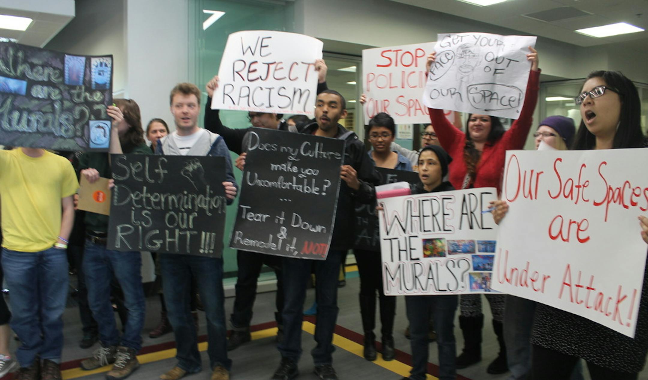 Protesters at March 12 ribbon-cutting ceremony at University of Minnesota's Coffman Memorial Union. Some participants have received letters from the U accusing them of "disruptive behavior" and threatening disciplinary action.