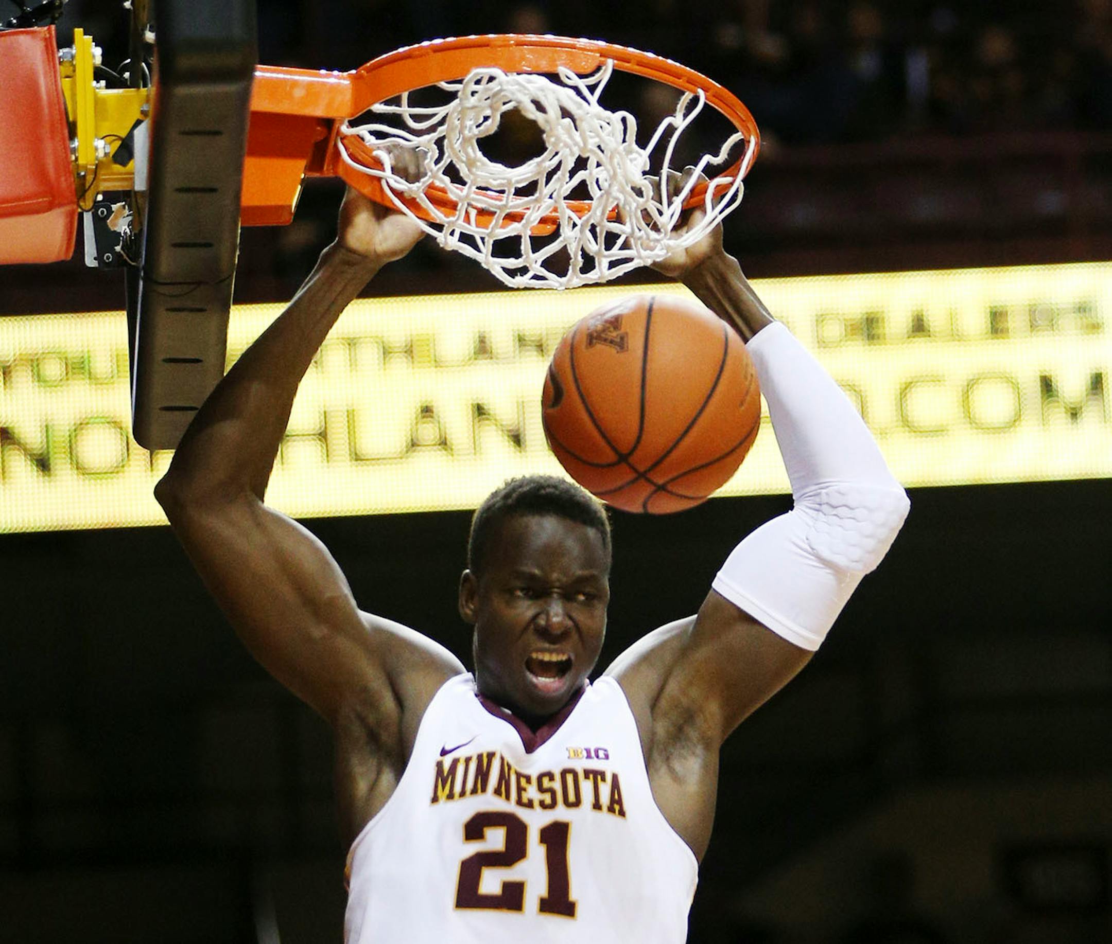 Gophers center Bakary Konate (21) dunked the ball in the second half against Northern Illinois.