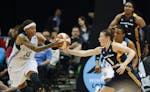 Minnesota Lynx guard Seimone Augustus (33) beat Indiana Fever guard Maggie Lucas (8) to a loose ball in the third quarter at Target Center Sunday even