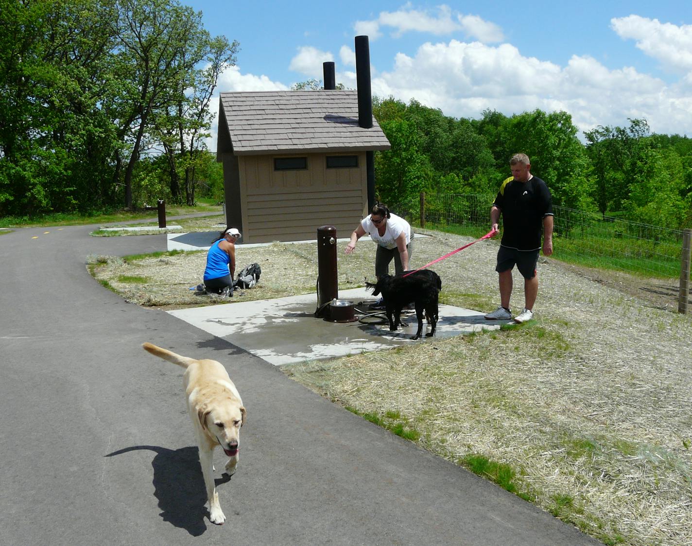 By David Peterson At the Spring Lake Regional Park off leash dog park in Prior Lake, overseen by Three Rivers parks district and Scott County Sue and Wayne Welke, right, were among those using the wash station and fountain