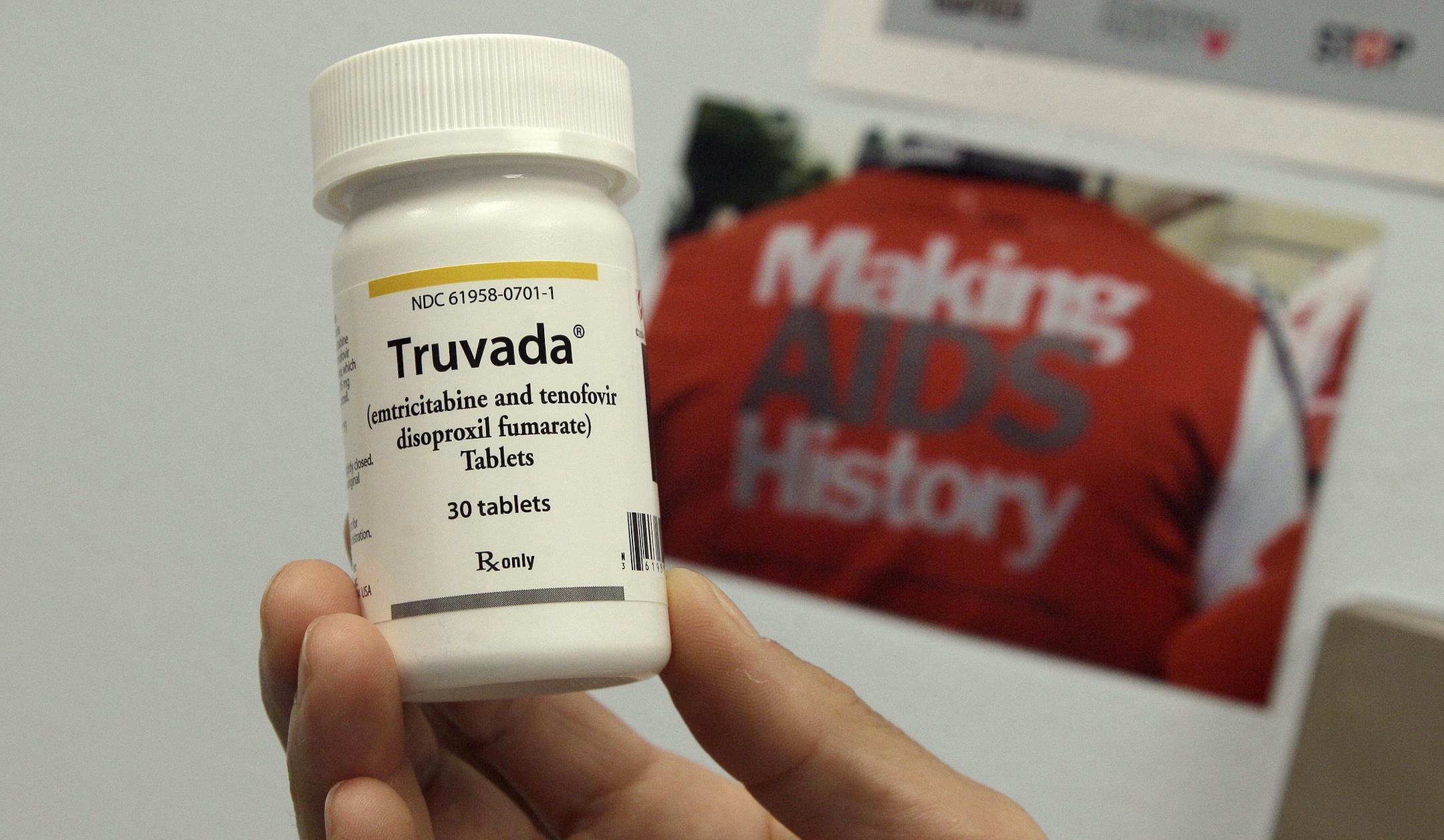 Dr. Lisa Sterman holds up a bottle of Truvada at her office in San Francisco, Thursday, May 10, 2012. Sterman prescribes Truvada off-label for about a dozen patients at high risk for developing AIDS. The pill, already used to treat people with HIV, also helps prevent the virus from infecting healthy people. (AP Photo/Jeff Chiu) ORG XMIT: CAJC204