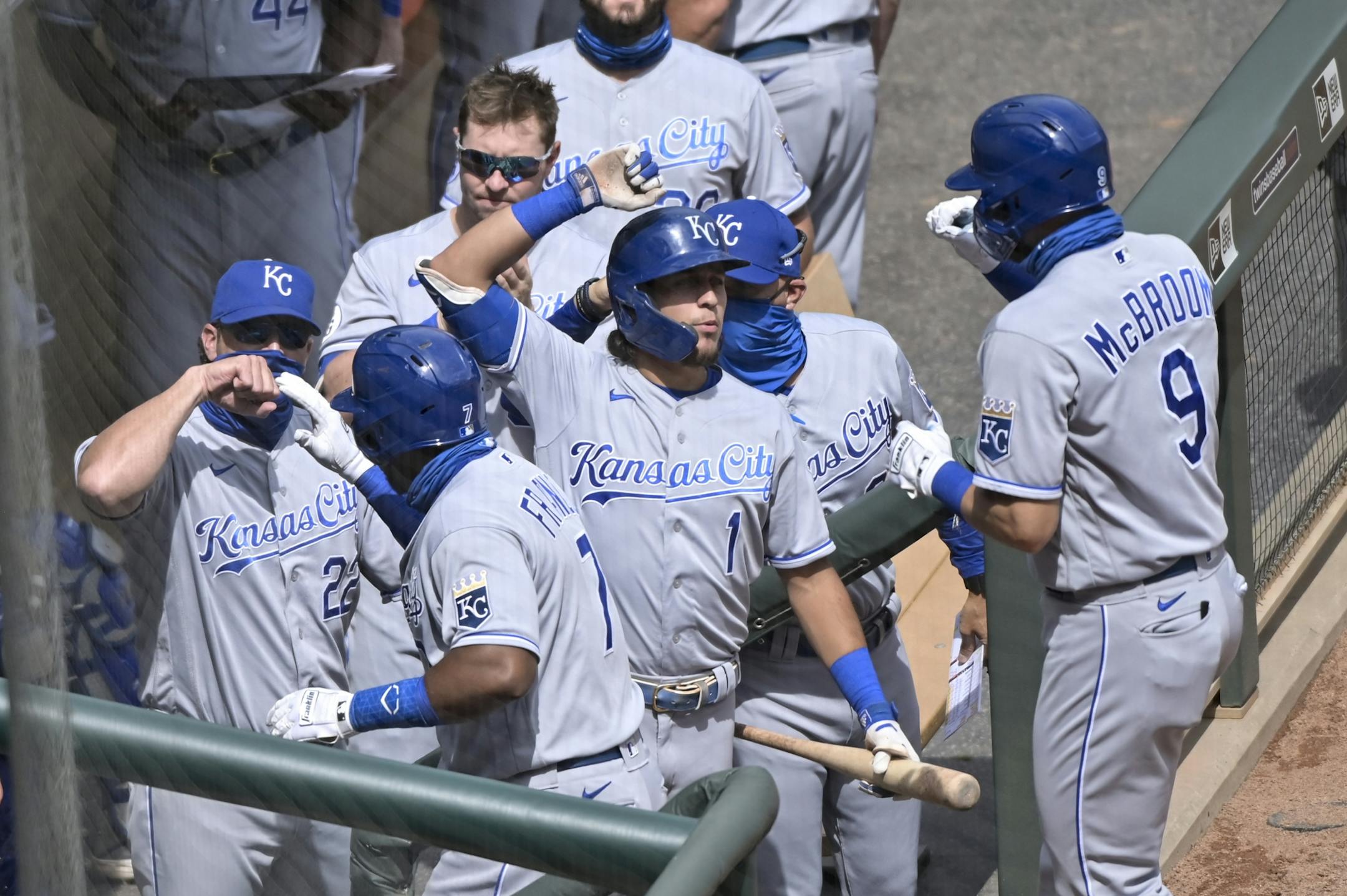 Kansas City Royals third baseman Maikel Franco (7) and first baseman Ryan McBroom (9) celebrated with teammates after Franco's 2-run home run in the top of the fifth inning against the Minnesota Twins.