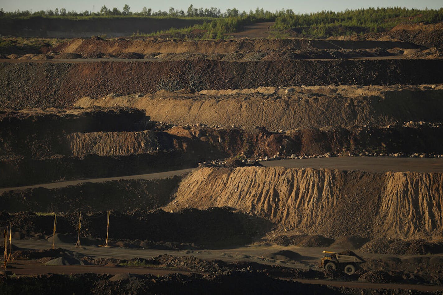 A dump truck transferred a load of ore from one part of the Hull-Rust-Mahoning Mine pit to another Wednesday evening in Hibbing.   ]  JEFF WHEELER • jeff.wheeler@startribune.com