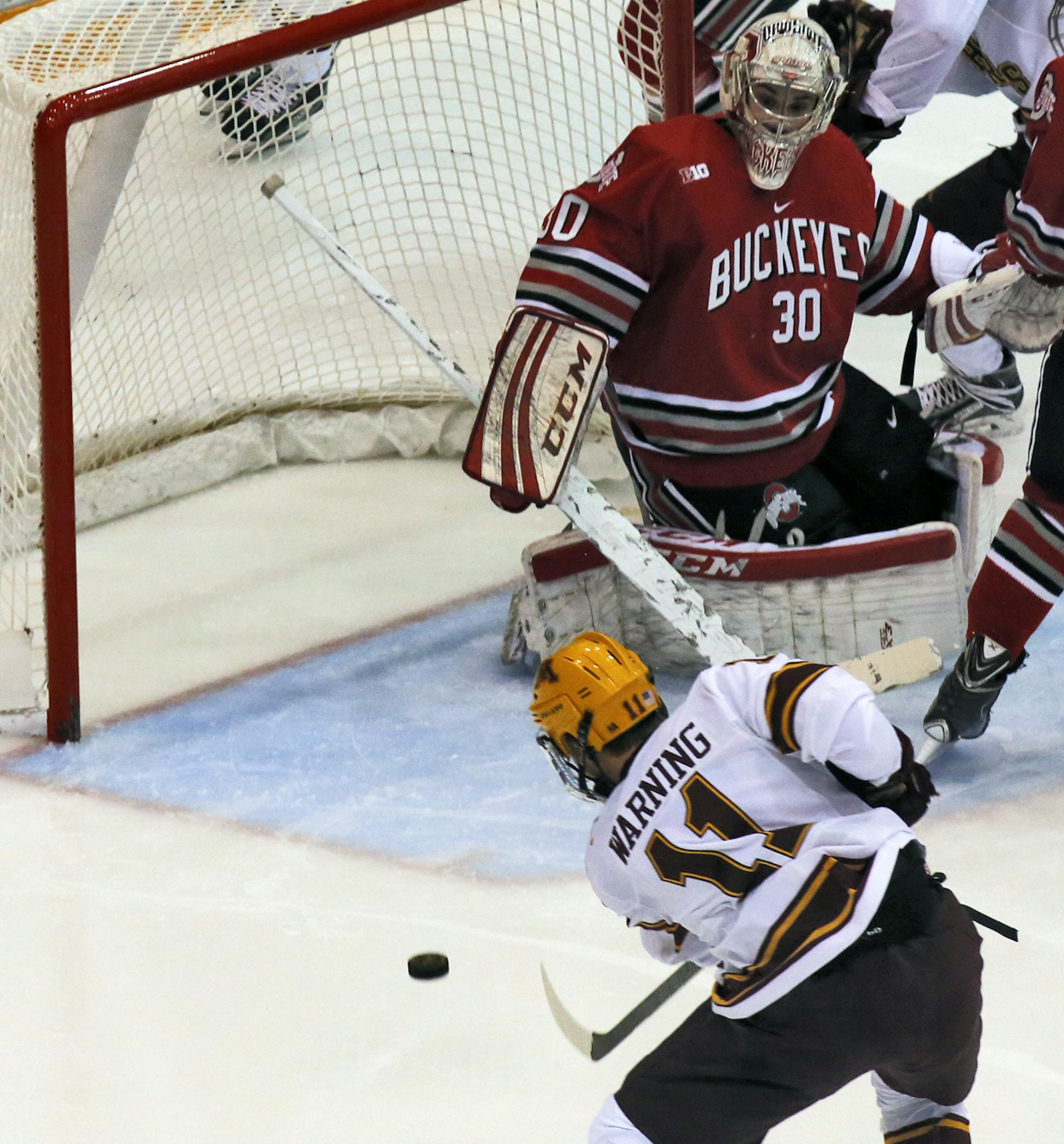 Minnesota Gophers vs. Ohio State hockey. Minnesota's Sam Warning flipped in the second of three goals scored in the first two periods of play beating Buckeyes goalie Christian Frey on the shot. (MARLIN LEVISON/STARTRIBUNE(mlevison@startribune.com)