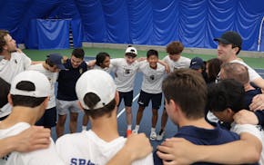 The St. Paul Academy team gathers for a rendition of "You Are My Sunshine" after its victory Wednesday.