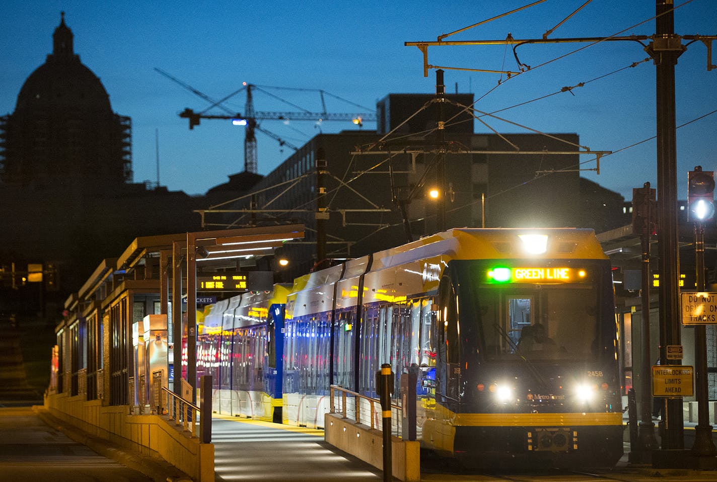 An eastbound Green Line train passed through St. Paul at the 10th Street Station on Friday night. ] Aaron Lavinsky &#x2022; aaron.lavinsky@startribune.com As the anniversary of the Green Line's opening approaches, we take another look to see how development along the line has progressed in the first year. Story focuses on St. Paul's University Avenue, the most challenged stretch of the 11-mile route. Bottom line: while few new projects have emerged since last year, city officials are taking the