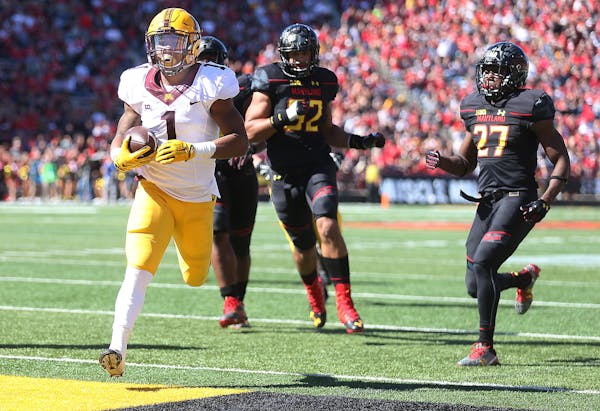 Minnesota's running back Rodney Smith ran the ball into the end zone for a touchdown in the second quarter as Minnesota took on Maryland at Capital On