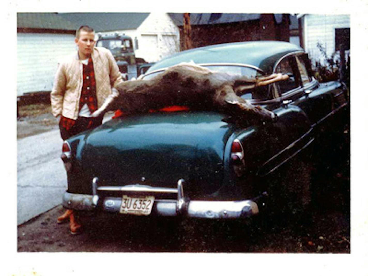 The author's father with his first doe taken in the 1960s. Love the car!