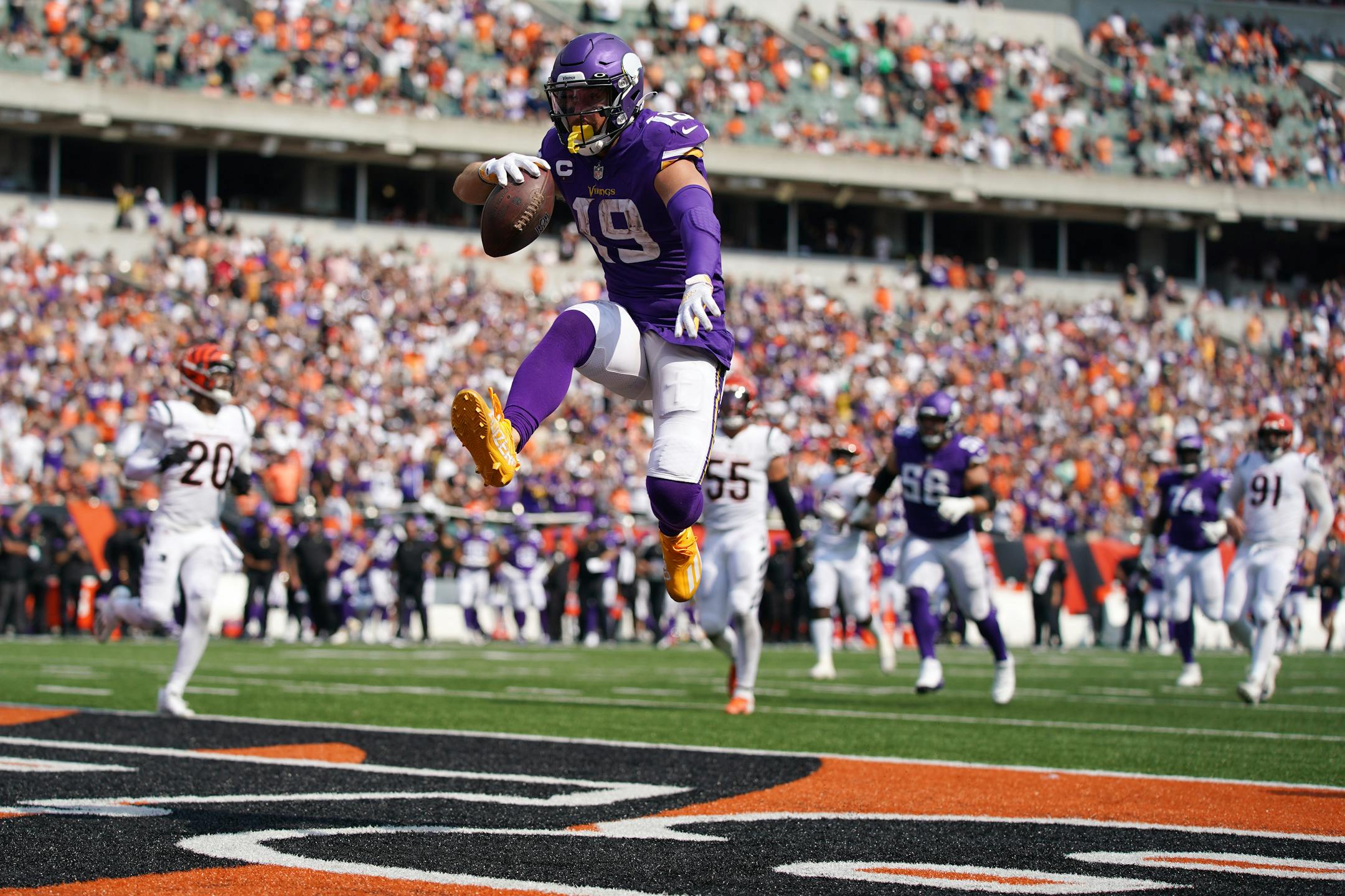 Minnesota Vikings wide receiver Adam Thielen (19) lept into the end zone with the ball to score a touchdown in the third quarter.