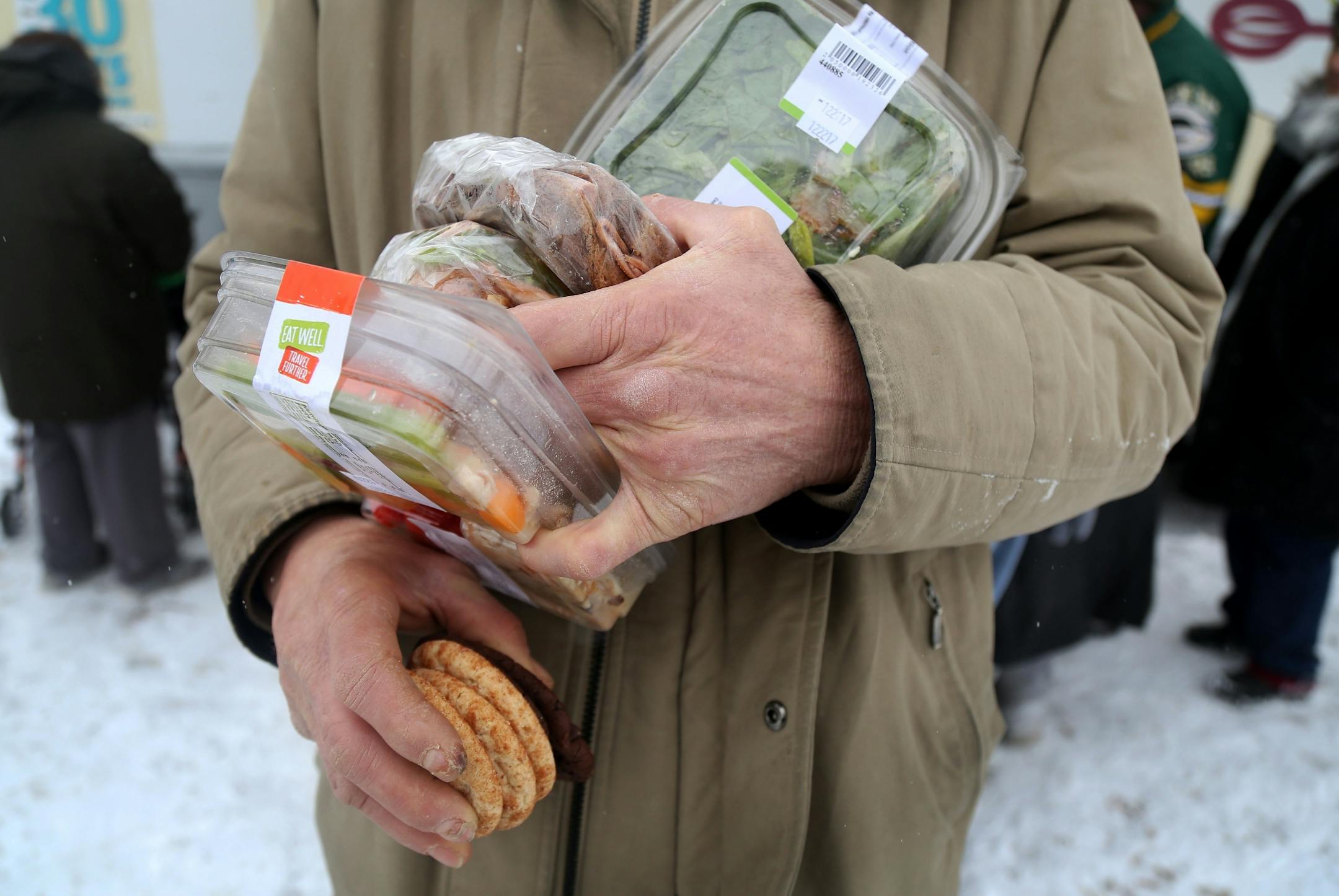 The local non-profit, Loaves and Fishes has partnered with the MSP Airport and concessionaire HMS Host to donate ready-to-eat meals not purchased at the airport, that would otherwise be thrown away, to the homeless near the Dorothy Day Center Thursday, Dec. 28, in St. Paul, MN.