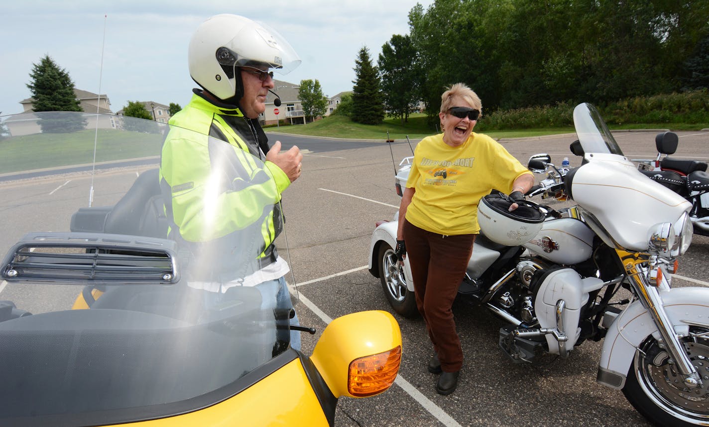 (left to right) Richard Thienes and Flo Cranor, both of Lakeville, prepared to head out on a Thursday morning ride from the Lakeville Heritage Center. Photo by Liz Rolfsmeier, Special to the Star Tribune