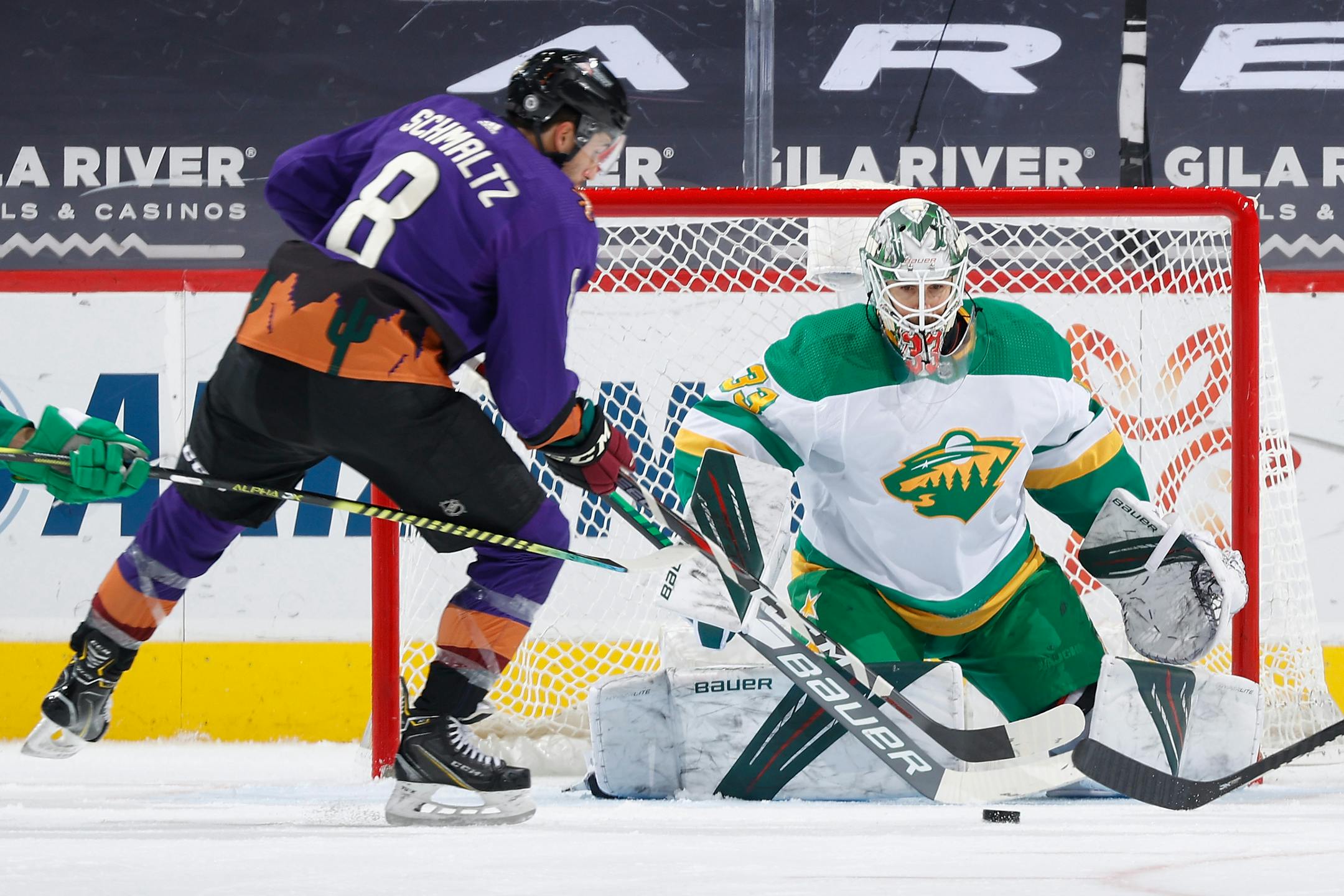 Minnesota Wild goaltender Cam Talbot prepares to make save on the Arizona Coyotes' Nick Schmaltz (8) during the second period at Gila River Arena in Glendale, Arizona, on Saturday, March 6, 2021. (Christian Petersen/Getty Images/TNS) ORG XMIT: 10402106W