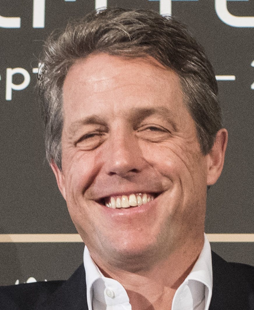 British actor Hugh Grant smiles during a press conference at the 12th annual Zurich Film Festival in Zurich, Switzerland, Tuesday, Sept. 27, 2016. The festival runs from Sept. 22 to Oct. 2, 2016. (Ennio Leanza/Keystone via AP)