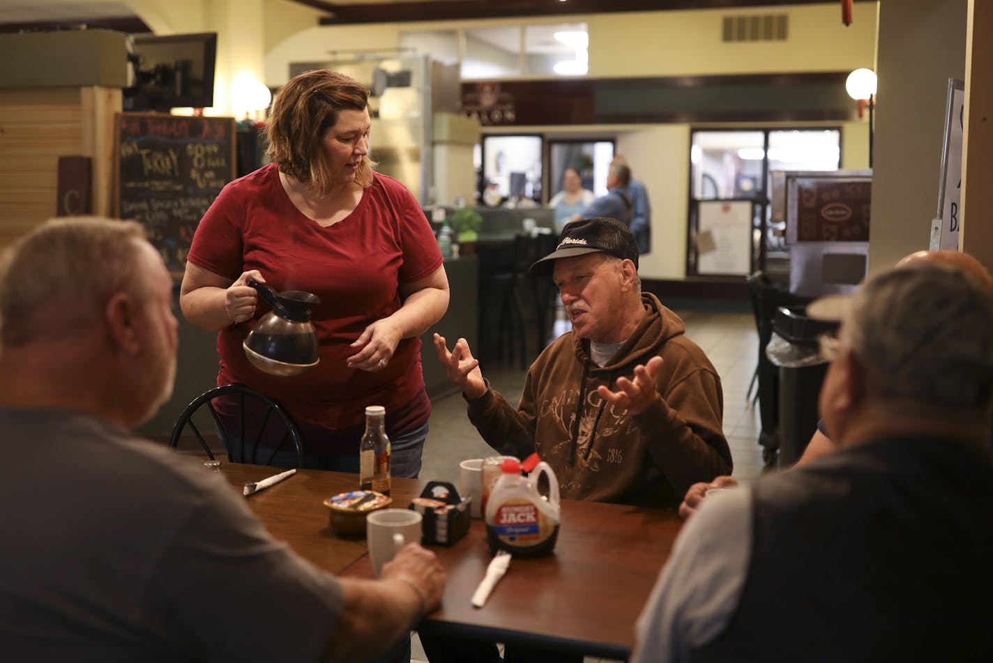 Tracy Bailey waited on customers at Bailey's Courtyard Cafe, where booths are full and business is healthy.