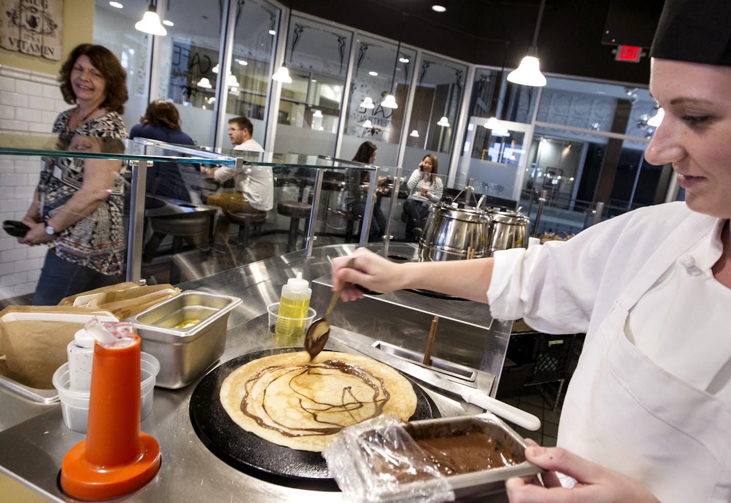 Emily Coomer makes a Nutella crepe at Cafe Zentral in the Skyway in Minneapolis September 26, 2014. (Courtney Perry/Special to the Star Tribune)