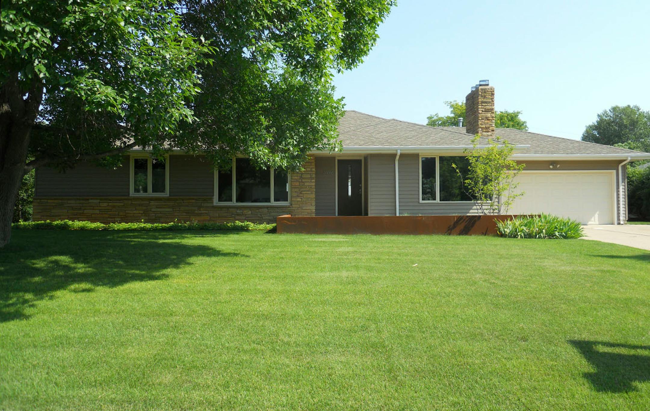 The "before" exterior had vinyl siding.