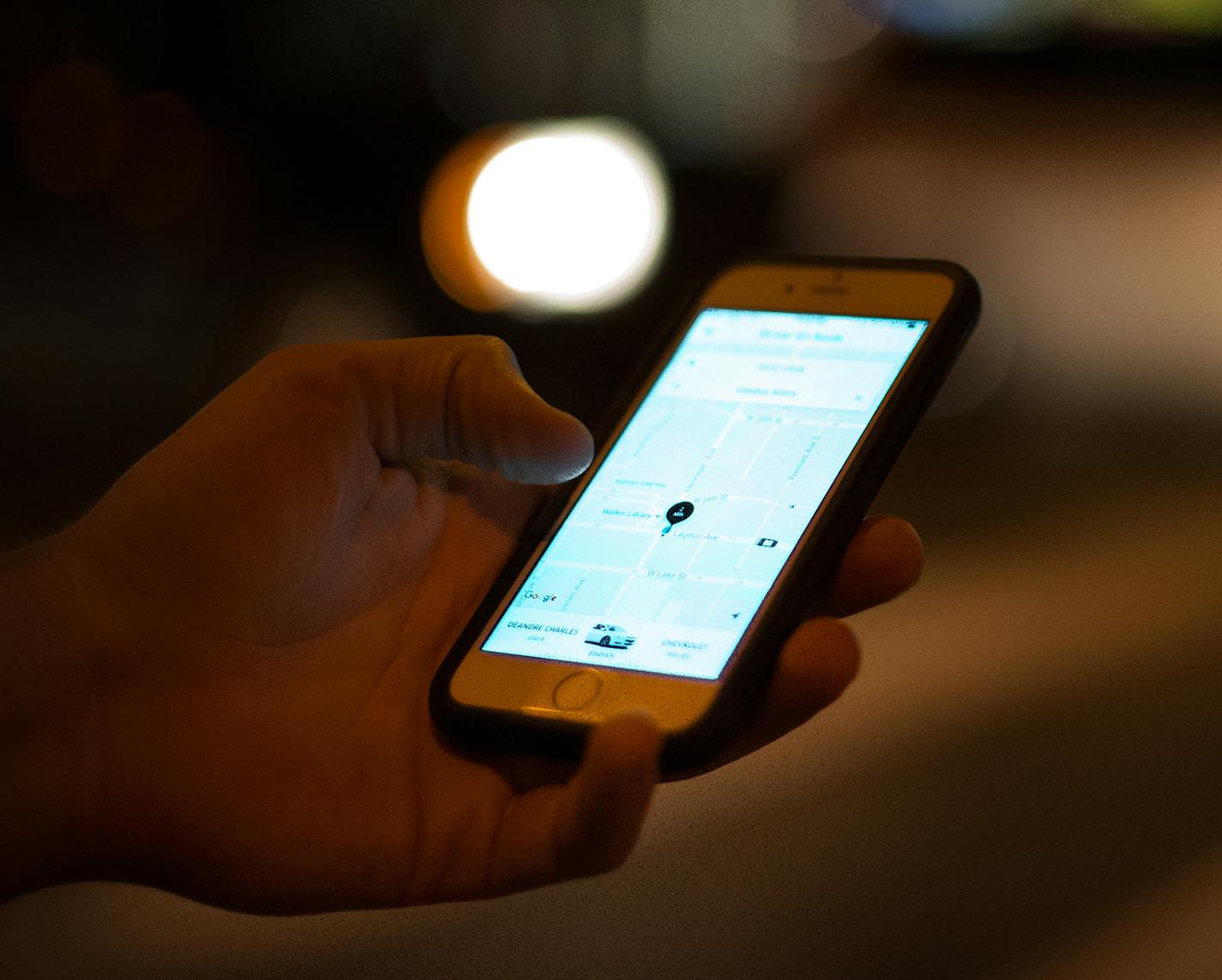 An Uber customer checked the status of his ride on his phone while waiting at the intersection of Lagoon Avenue and Hennepin Avenue late Saturday night. ] (AARON LAVINSKY/STAR TRIBUNE) aaron.lavinsky@startribune.com Uber and Lyft drivers picked up bar patrons at Lagoon Avenue and Hennepin Avenue in Minneapolis on Saturday, August 6, 2016. ORG XMIT: MIN1608142326251014