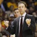 Minnesota head coach Richard Pitino gestures to his players during the first half of an NCAA college basketball game against Illinois in Minneapolis, 