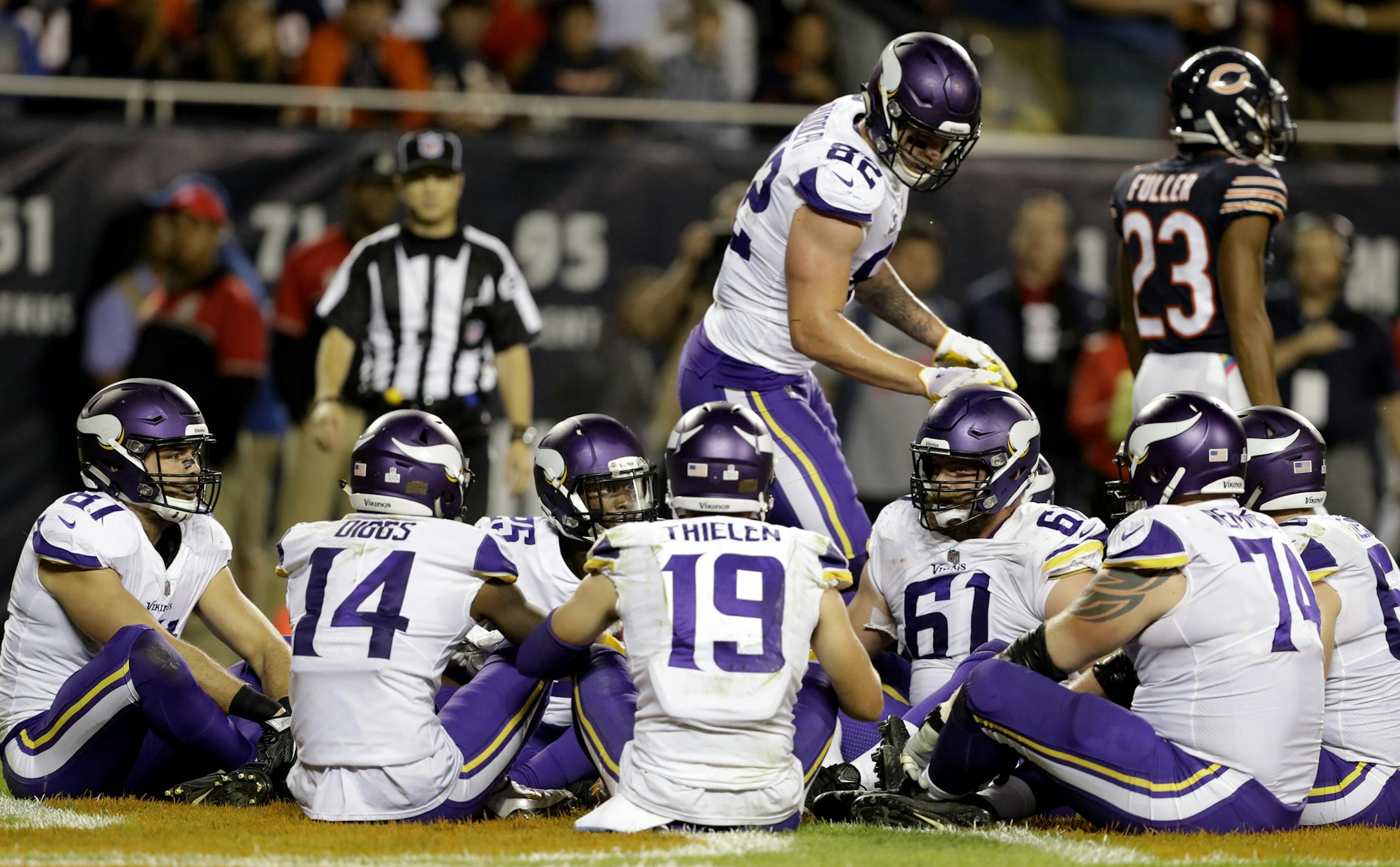 FILE - In this Monday, Oct. 9, 2017, file photo, Minnesota Vikings tight end Kyle Rudolph (82) celebrates a touchdown with his teammates during the second half of an NFL football game against the Chicago Bears in Chicago. Rudolph initiated a humorous group celebration of his touchdown catch on Monday night with a brief rendition of the children's game "Duck, Duck, Goose" in the end zone. Except in Minnesota, the only state where this is the case, the game is called "Duck, Duck, Gray Duck." (AP P