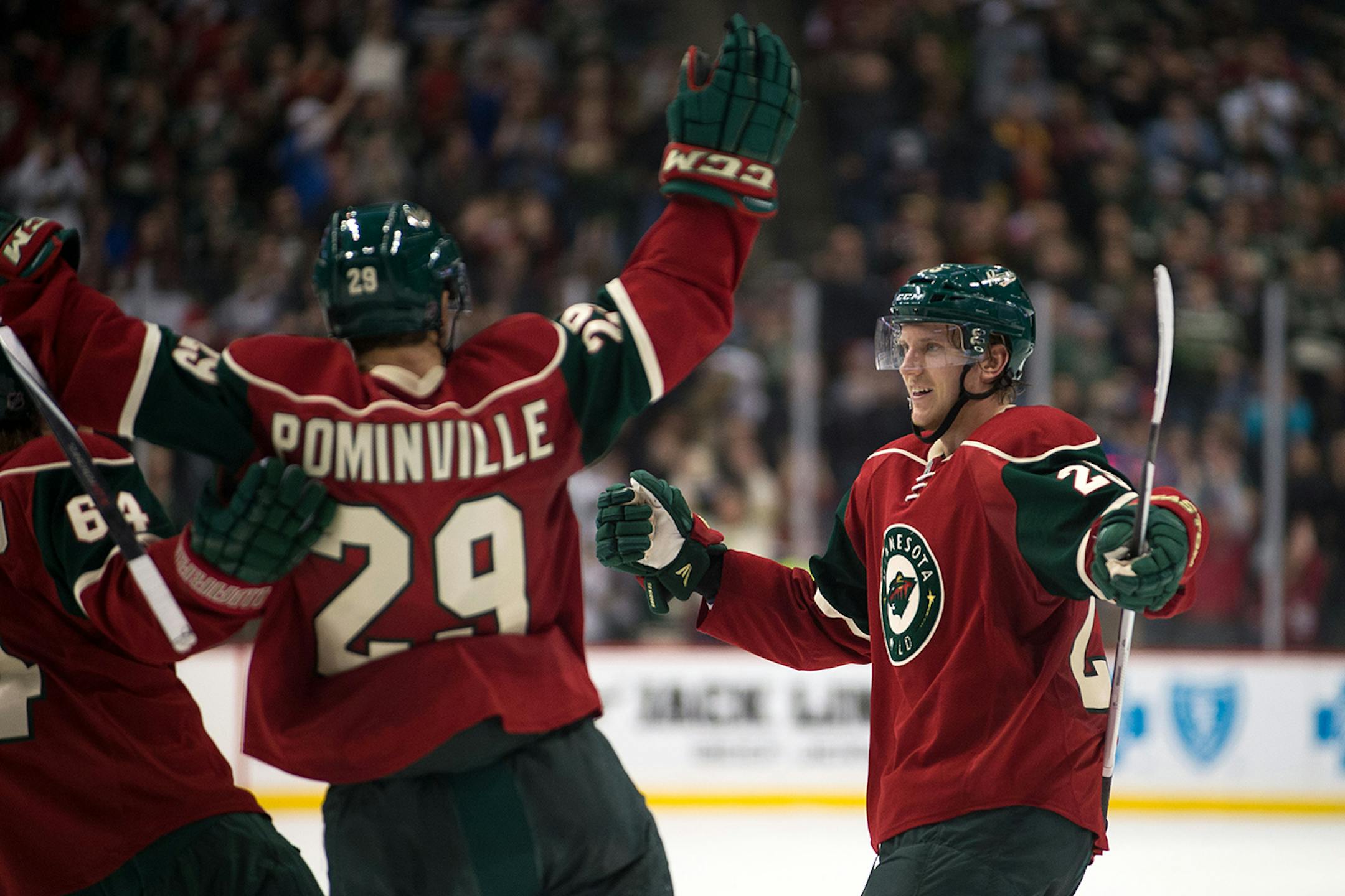 Minnesota Wild center Mikael Granlund (64) and right wing Jason Pominville (29) celebrate after a goal last season.