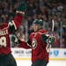 Minnesota Wild center Mikael Granlund (64) and right wing Jason Pominville (29) celebrate after a goal last season.
