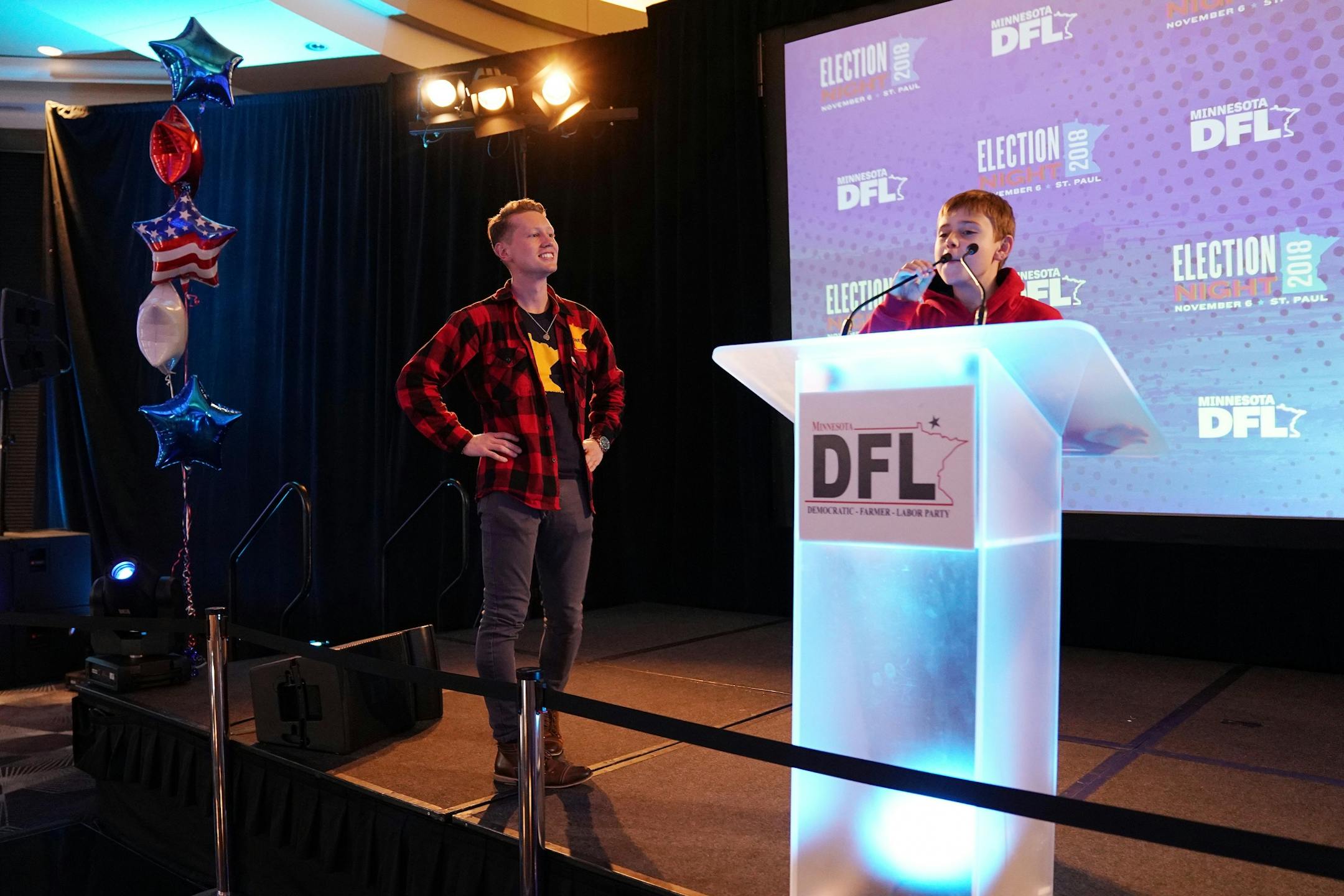 Gus Walz, son of DFL gubernatorial candidate Tim Walz, checked out the podium as he toured party's election night headquarters.