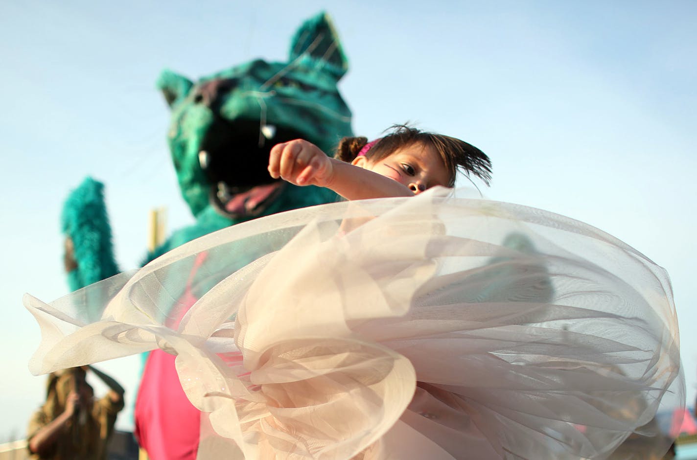 Juna Roth, 5, of Minneapolis played in front of a gigantic cat from Heart of the Beast before the start of the Cat Video Festival hosted by the Walker Arts Center. ] (KYNDELL HARKNESS/STAR TRIBUNE) kyndell.harkness@startribune.com Cat video festival at CHS Field in St Pauls, Min., Wednesday August 12, 2015. ORG XMIT: MIN1508122001450096