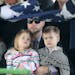 Brian Muller, held his children EmmyLu, 3, and Jace, 5, as the Air Force Honor Guard folded an American Flag that was given to him during the military