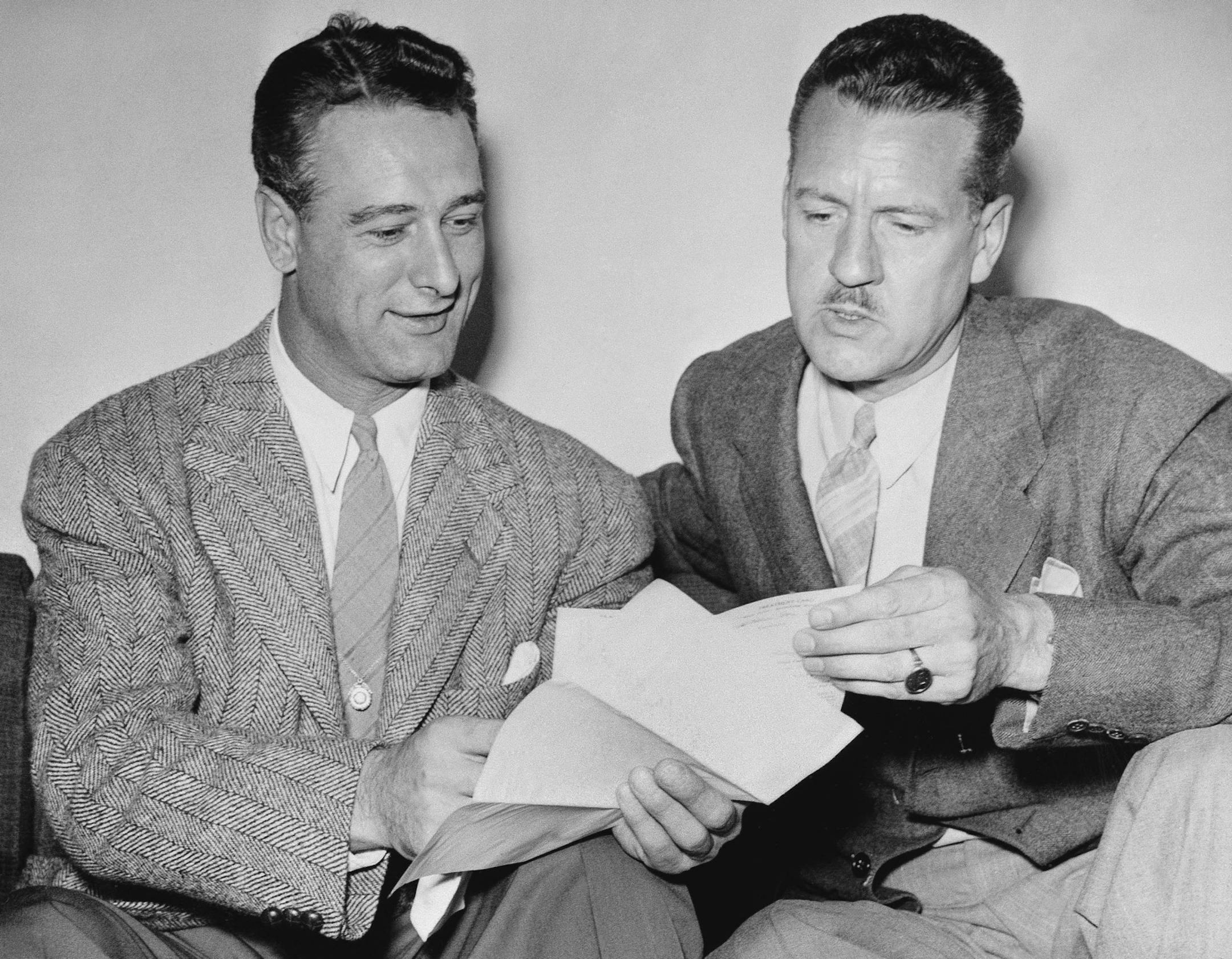 Lou Gehrig, left, of the New York Yankees and Dr. Robert Gilman went over a 1939 Mayo clinic report. Others now want to see those medical records.