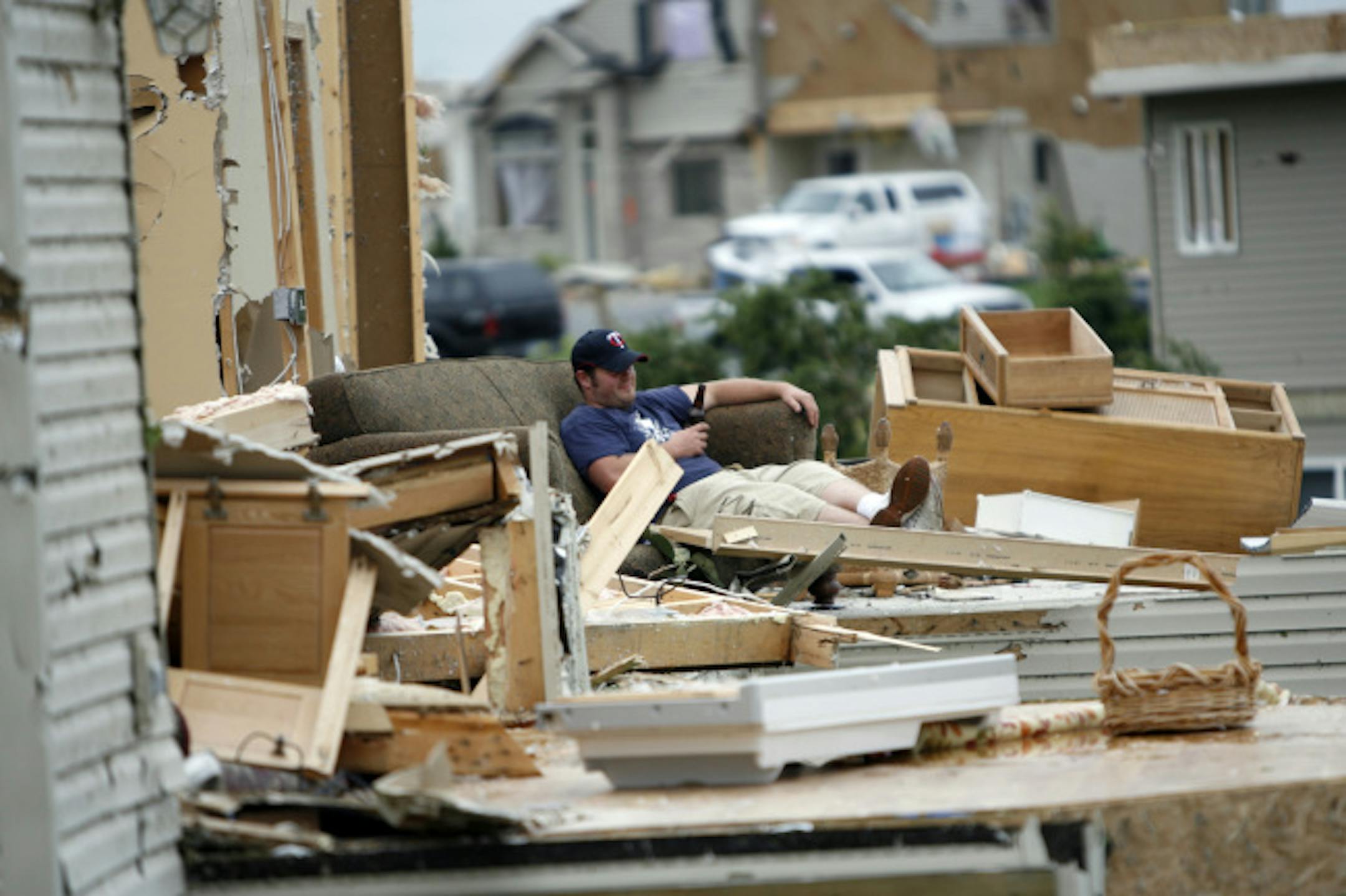 The front door of Tom Kolnik's house in Hugo was blown out, revealing how the tornado had torn away the back section of the house.