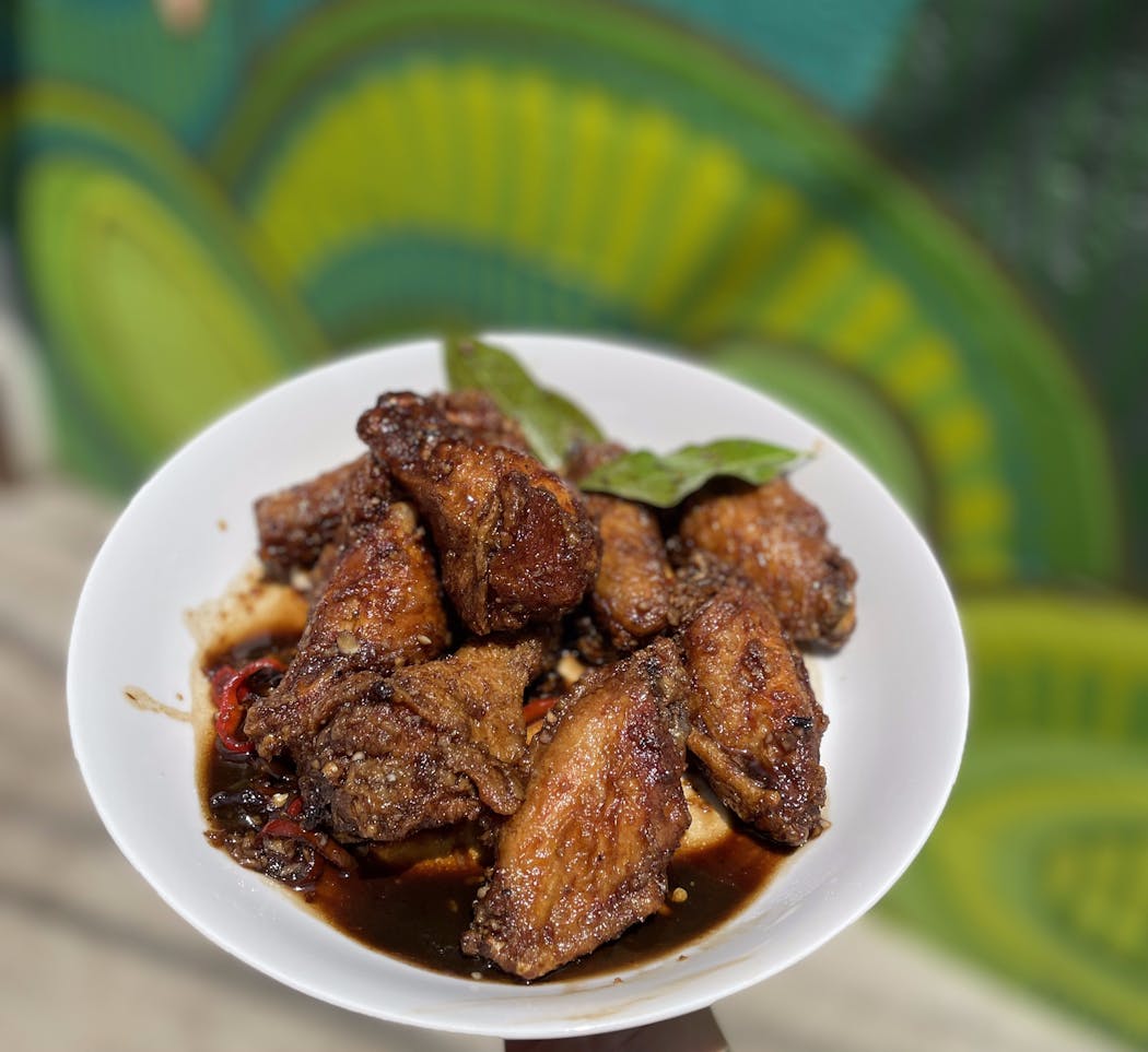 Crispy fried adobo wings on the alley patio at Melt.