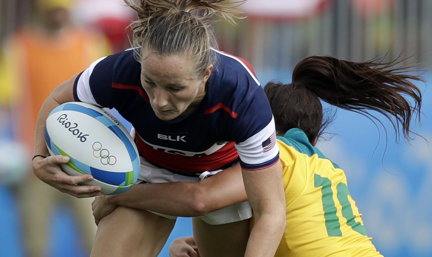 USA's Kathryn Johnson, left, is tackled by Australia's Alicia Quirk, during the women's rugby sevens match at the Summer Olympics in Rio de Janeiro, Brazil, Sunday, Aug. 7, 2016. (AP Photo/Themba Hadebe)