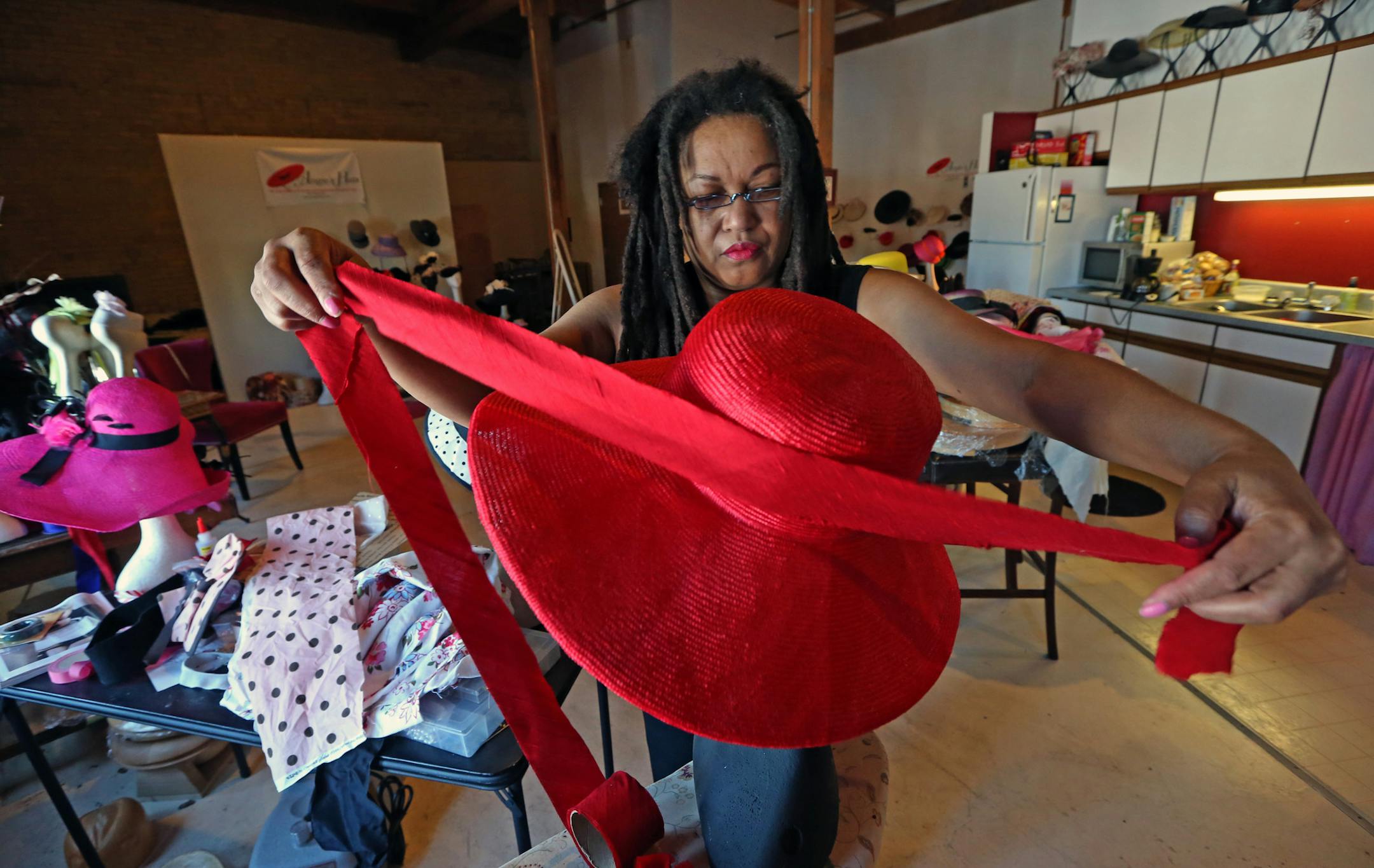 For hat maker Angie Hall Sandifer, the bigger the better. She makes custom hats, large ladies hats, for the most part for individual customers and shops in St. Paul and new Orleans. Photographed on 1/8/14.} Bruce Bisping/Star Tribune bbsiping@startribune.com Angie Hall Sandifer/source.