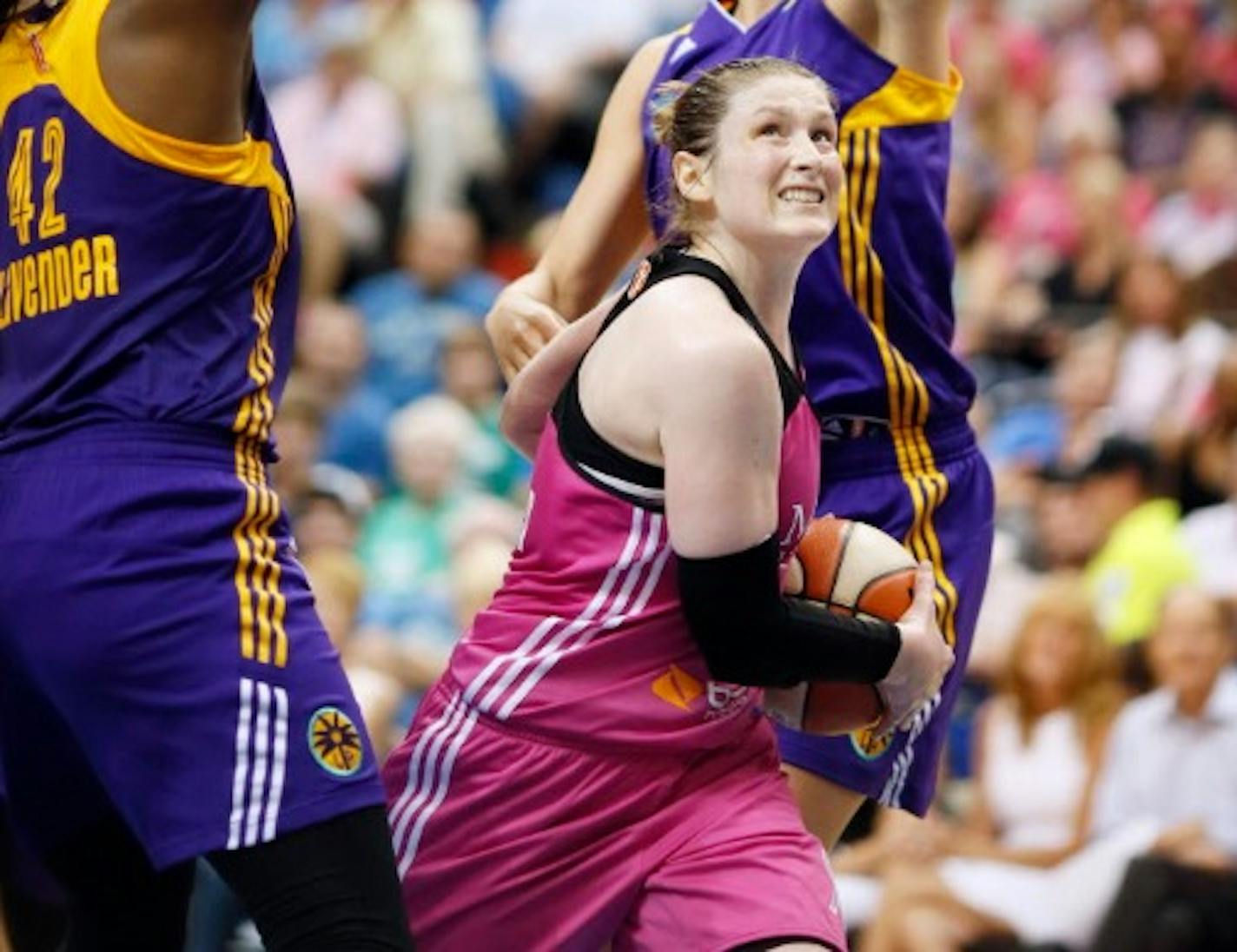 Lynx guard Lindsay Whalen drove between two Los Angeles defenders during a game in August.