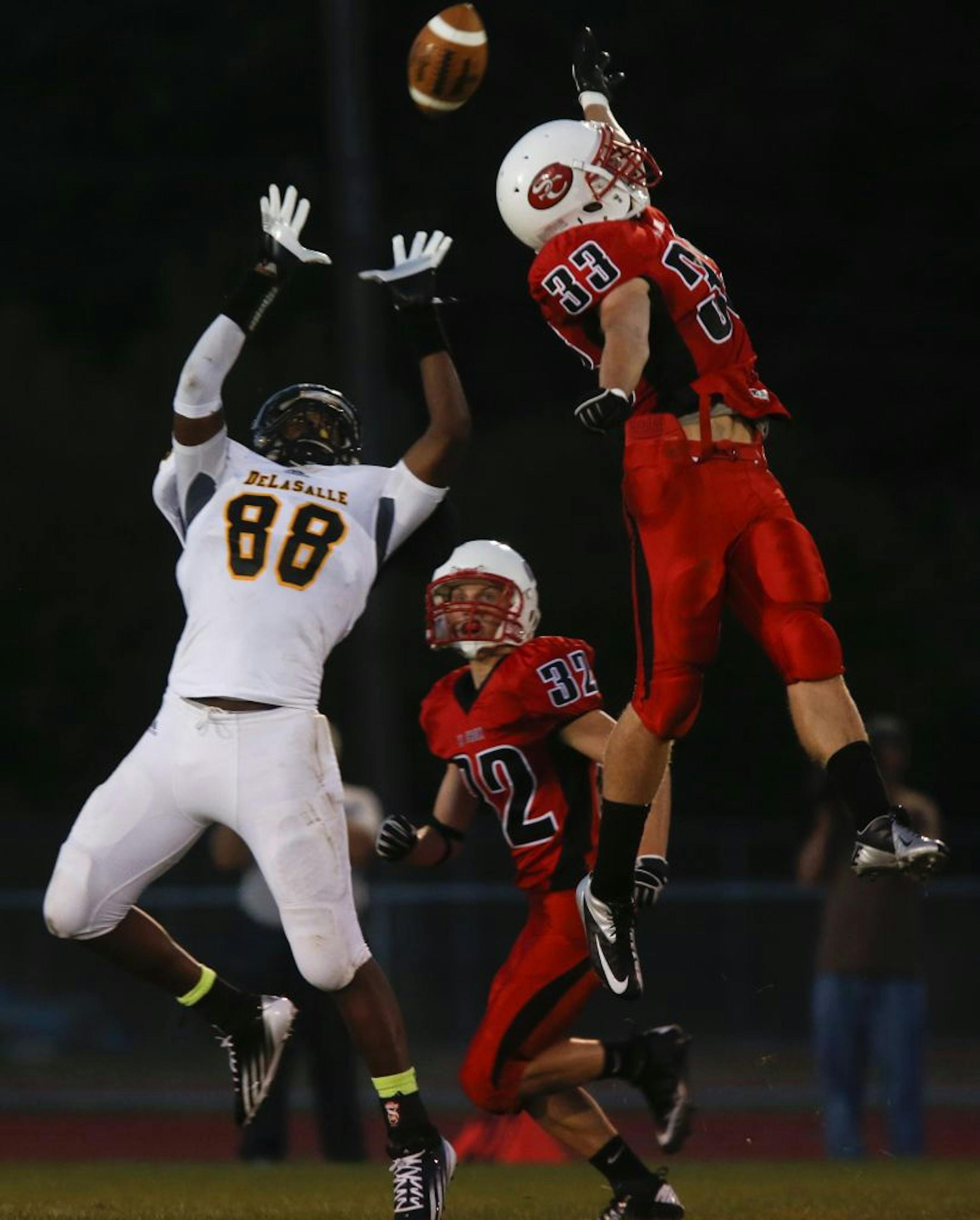 St. Croix Lutheran's Jackson Goplen tipped the pass intended for DeLaSalle's Jareid Combs during first quarter action at St. Croix Lutheran in West St. Paul, Min., Friday September 12, 2012.