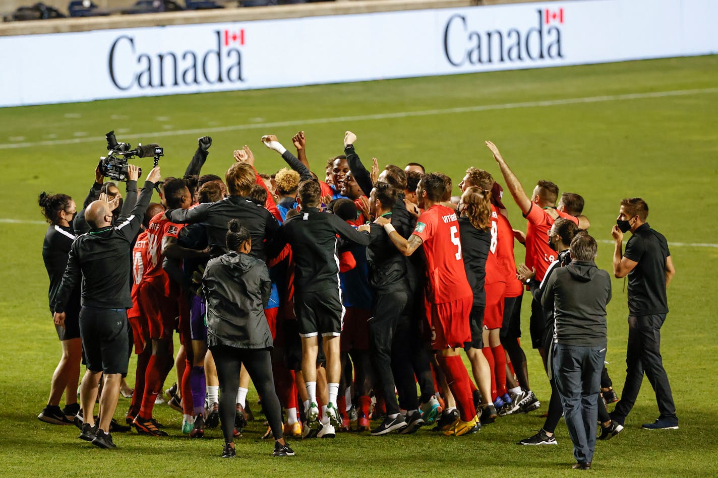 Canada celebrates a 3-0 win over Haiti in a World Cup qualifying soccer match, Tuesday, June 15, 2021, in Bridgeview, Ill. (AP Photo/Kamil Krzaczynski)