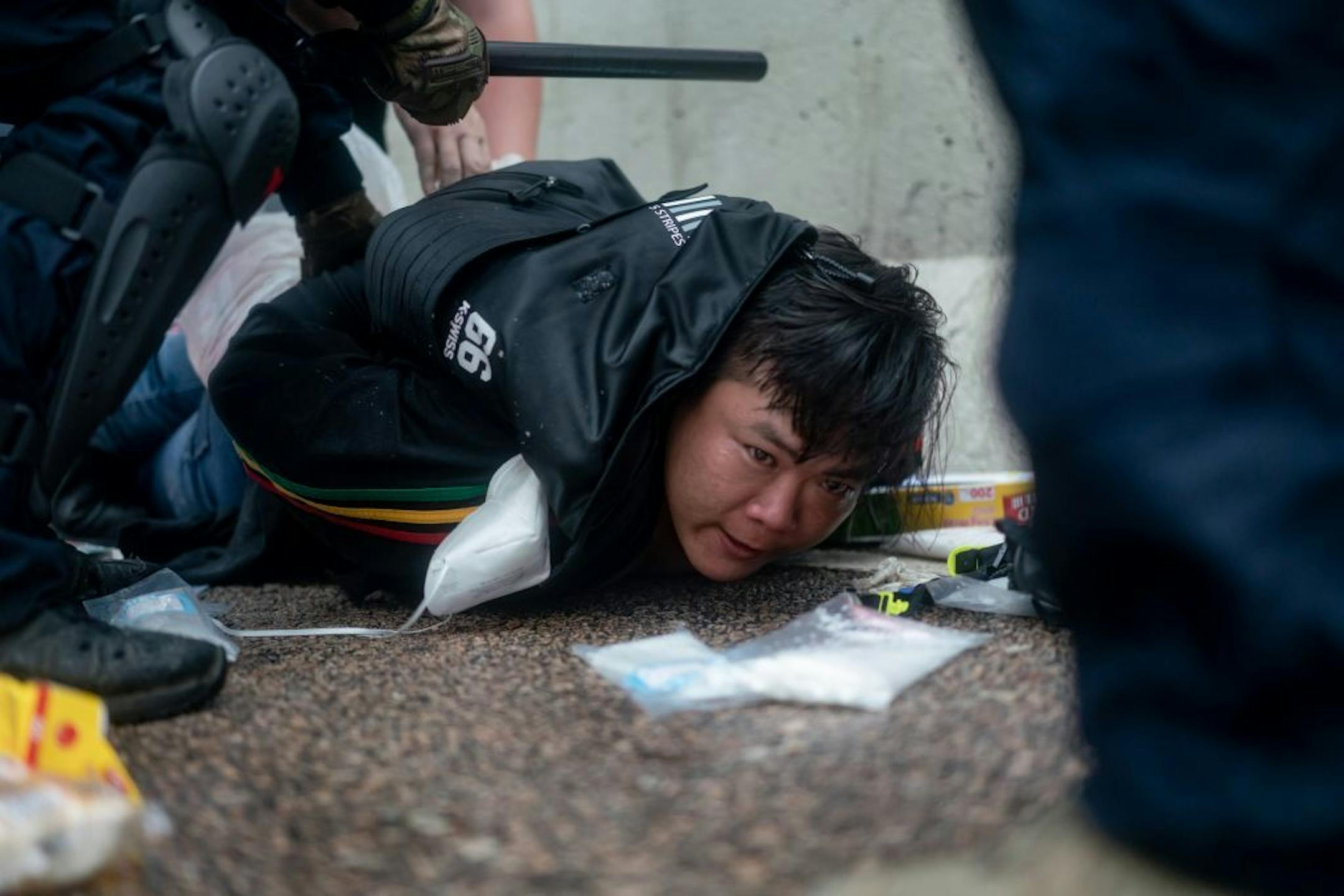 A protester is arrested by police officer during a protest on June 12, 2019 in Hong Kong China. Large crowds of protesters gathered in central Hong Kong as the city braced for another mass rally in a show of strength against the government over a divisive plan to allow extraditions to China.