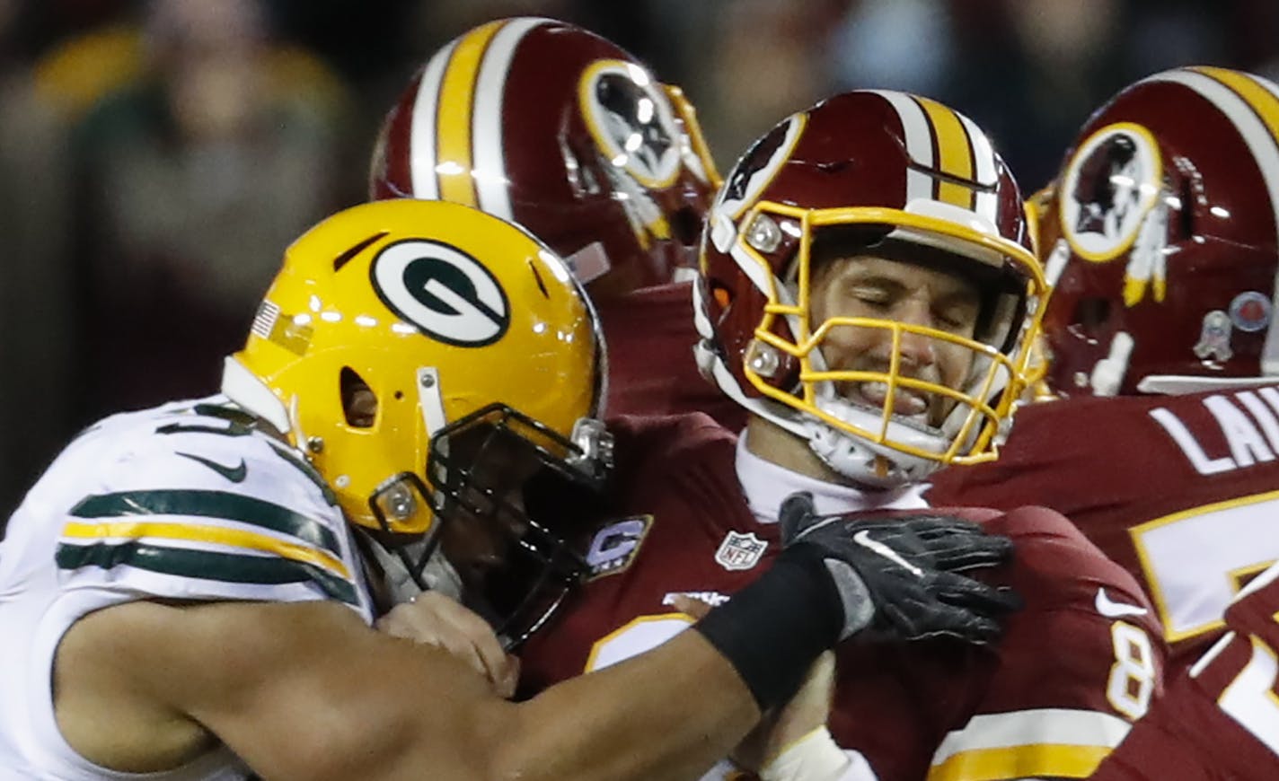 Washington Redskins quarterback Kirk Cousins (8) is sacked by Green Bay Packers outside linebacker Nick Perry (53) during the first half of an NFL football game in Landover, Md., Sunday, Nov. 20, 2016. (AP Photo/Alex Brandon) ORG XMIT: FDX104